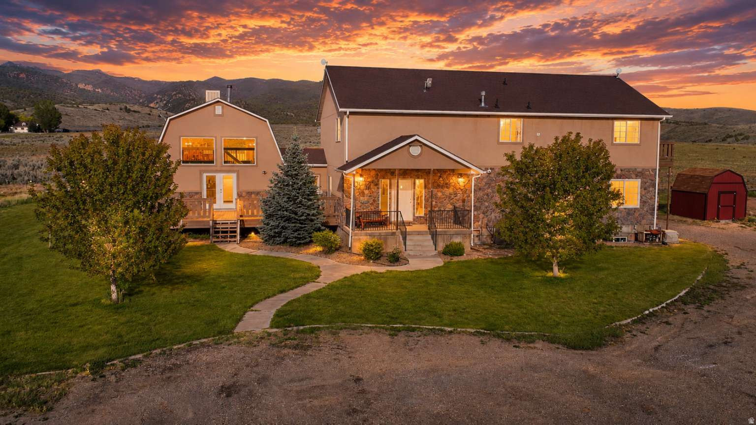 Bring your horses, ATVs, and dreams! This 6,800 sq ft custom home sits on 14.6 acres with panoramic mountain views just 25 minutes from Spanish Fork. In the Nebo School District with bus stop at the driveway! Featuring multiple gathering areas, and flexible spaces for offices, hobbies, theater, fitness, homeschooling, multi-generational living, or additional bedrooms. Enjoy a basketball court, pond, animal shelters, sheds and plenty of room to roam. Explore directly from the property to beautiful, private BLM and National Forest trails. High-speed internet. County zoning offers flexibility for home-based businesses, livestock, hobby farming, equipment storage, and a variety of rural lifestyle uses. Excellent large group Airbnb prospect! Large picture windows showcase spectacular views while providing the privacy and space that's increasingly hard to find. A rare opportunity to enjoy country living without sacrificing access to schools, services, recreation, and commuting convenience.