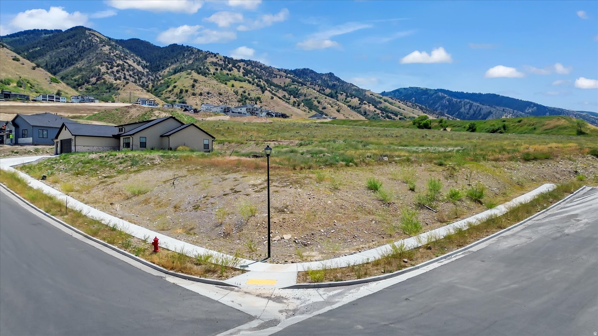 Great corner lot in Phase 1 of Homes on the Knoll with views of the Wellsville Mountains. This subdivision's development is completed so you can start building your dream home now! Bring your own builder, CCR's available upon request.  Buyer to verify all information.