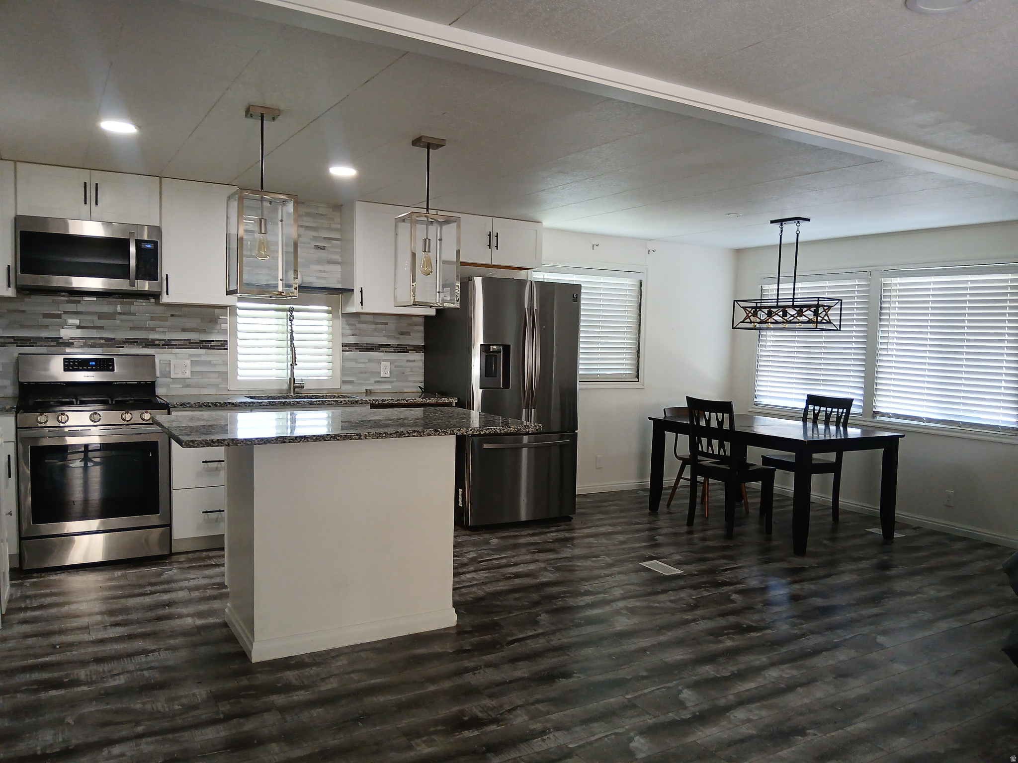 This spacious double-wide unit has been fully updated. Features include granite countertops, updated cabinets, newer appliances, LVP flooring throughout, and a refreshed bathroom. Must see.