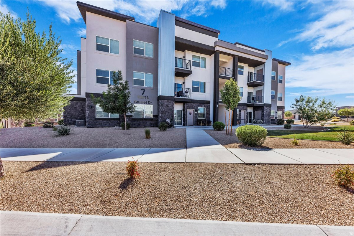 Welcome to Desert Color, where every day feels like a vacation! This beautifully maintained second-floor condo offers 2 bedrooms, 2 bathrooms, and a private one-car garage, making it the perfect full-time home, weekend getaway, or lock-and-leave retreat. The real showstopper is the incredible Desert Color lifestyle. Enjoy exclusive access to the 2.5-acre lagoon with crystal-clear water and soft white sand beaches, plus paddleboarding, kayaking, beach volleyball, a resort-style pool and spa, pickleball courts, walking trails, and year-round community events. It's like having a vacation destination right outside your front door. Conveniently located just minutes from I-15, shopping, dining, golf, and everything St. George has to offer, this home combines low-maintenance living with resort-style amenities in one of Southern Utah's most sought-after communities.   Square footage figures are provided as a courtesy estimate only and were obtained from county records.  Buyer is advised to obtain an independent measurement.