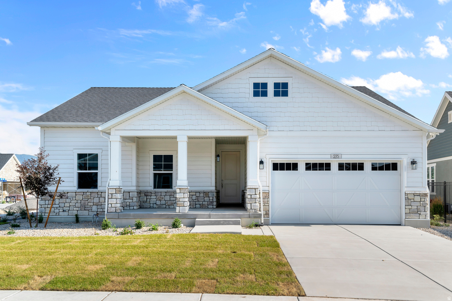 This beautiful Cottonwood home blends modern finishes with thoughtful upgrades throughout all located in a great active adult gated Stansbury Park community with access to walking trails, community pool and pickleball courts. Amazing features include a tankless water heater, gas log fireplace, and comfort-height toilets. The owner's suite boasts quartz shower surrounds, Euro glass enclosure, and satin & brushed nickel hardware. Enjoy a modern kitchen with gray laminate cabinets, quartz countertops and a full tile backsplash, all paired with stainless steel gas appliances. Durable laminate hardwood, tile, and carpet flooring flow through the space, accented by can lighting and Christmas light outlets and finished with wood stair railings and large Craftsman-style base and casing for timeless character. Comes fully landscaped and is maintained by the HOA for easy care living, all in a great community!