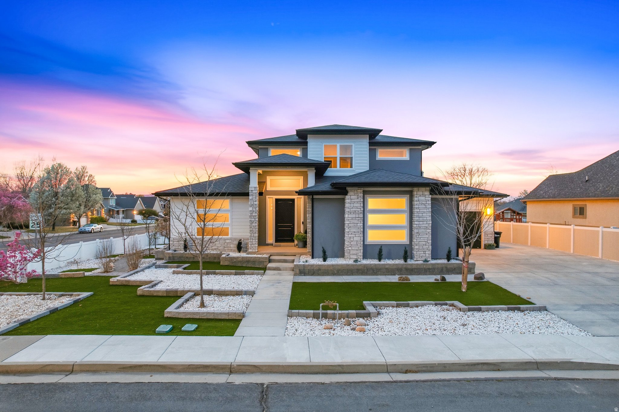 Modern Springville home, with NO HOA, just half a mile from Hobble Creek Canyon, offering rare direct access to one of the area's best outdoor lifestyles. Ideal for the buyer who wants to ride ATVs, motorcycles, or UTV's straight from home into the canyon and onto hundreds of miles of trails or bicycle to beautiful Hobble Creek golf course on dedicated path but still be convenient to city life. Within walking distance to Hobble Creek Park and Bartholomew Pond where you can fish, swim, and watch trout in the clear water, but still within 15 minutes of BYU, Costco, Sam's Club, Home Depot, and Magleby's Restaurant. 10 min walk to new Springville High School. This home was built with serious intention, and it shows in every room. Features 9-foot ceilings on the main and upper floors, a vaulted ceiling in the main-floor family room, and a 10-foot ceiling in one upstairs bedroom. Custom staircase railing adds style and character. Quartz countertops throughout all kitchens and bathrooms. Spacious kitchen includes double KitchenAid ovens, an 800 CFM vent hood, gas-plumbed range, soft-close cabinet hinges, and a huge cantilevered pantry over the garage that stays cool year-round, plus its own HVAC duct for added summer cooling. The primary suite includes a large soaking tub, European-style doorless shower, dual sinks, an oversized walk-in closet with makeup table, and an electrical outlet by all toilets for a bidet. Main laundry room offers space for a washer, dryer, and two refrigerators and sink to clean up in after hitting the trails. Zoned furnace allows each floor to be heated separately. Cat-5 to all rooms adds modern convenience. Basement family room is designed as a true theater space with an extra-insulated ceiling using Isoclips, dual sheetrock and sound-dampening glue; RSL, Polk and Sony 7.1 surround speakers and Sony projector are included with Onkyo receiver. Basement also features a second kitchen, exterior entrance and 2 bedrooms with huge closets offering excellent flexibility. The exercise area features a squat rack, bar, bench, and treadmill. Over 900 sq/ft of garage space is exceptionally well equipped with wiring for four more 220V plugs in addition to the two Level 2 Tesla chargers, which include CCS adaptor and NACS enabling fast charging of any EV. Pegboard workstation in the third-car bay is included, and the third-car bay is over 25' long and 15' wide so feel free to park your crew cab long bed inside. RV parking runs along the north side of the home and connects to concrete pad in the back for parking more toys. Gas bibs are installed in the main-floor family room and upstairs loft for a future gas fireplace or heater and also included on patio with Blackstone griddle for big family cooking and parties. All rooms are pre-blocked for ceiling fans. The yard is low-maintenance by design - artificial turf, minimal water use, and nothing to mow. For buyers who want to personalize it, the infrastructure is already in place: an automatic irrigation system with extra unused lines, and turf and gravel that are straightforward to replace with grass, landscaping, or whatever fits your vision. A growing honeysuckle privacy wall enhances the south side yard and brings in the hummingbirds. Fruit trees include 2 apple trees, 2 peach trees, 2 cherry trees, and 1 pear tree, each with its own dedicated drip line. Eaves are wired for Christmas lights, making seasonal decorating or installation of year round holiday lights easy. Square footage figures are provided as a courtesy estimate only and were obtained from an appraisal. Buyer is advised to obtain an independent measurement.