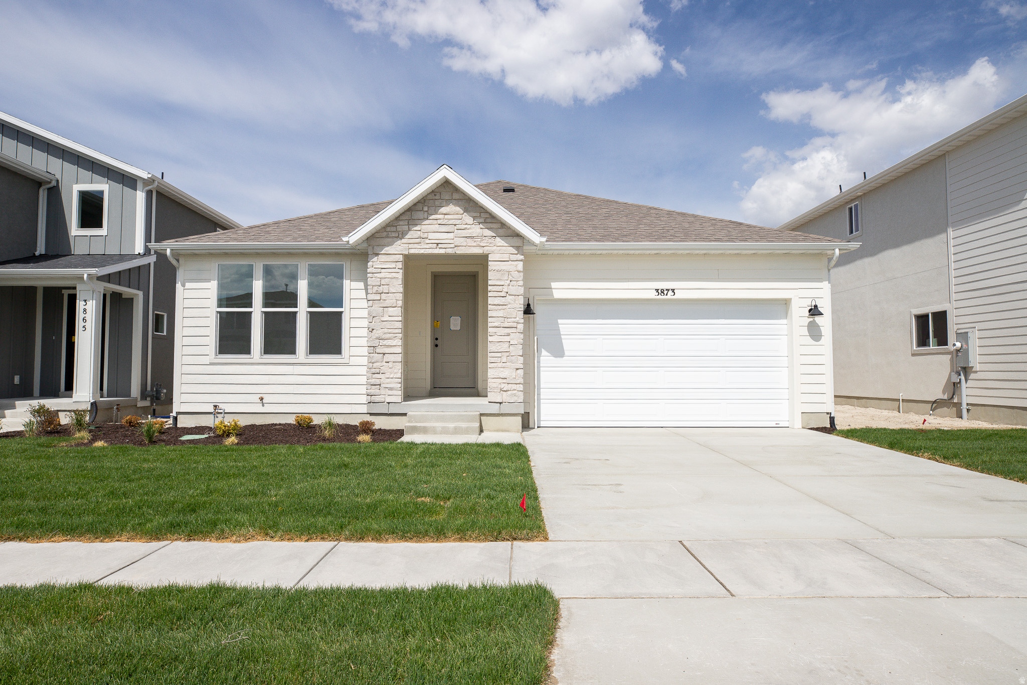 INTEREST RATES STARTING AS LOW AS 4.99% with our preferred lender or AMAZING $15,000 INCENTIVE TOWARDS CLOSING COSTS, RATE BUYDOWN, OR PRICE REDUCTION REGARDLESS OF LENDER! (Talk to agent for conditions). Must-see Harmony Community in Eagle Mountain! Move-in ready! This beautiful home built by Flagship Homes features 3 bedrooms, 2 bathrooms, quartz slab countertops, painted cabinets, laminate flooring on the main level, vaulted ceilings on the entire main level, landscaped front yard and 2 car garage. The backyard can be landscaped for an additional charge. The primary bedroom has a vaulted ceiling, large walk-in closet, and dual sinks with a separate tub/shower. With an unfinished basement, this home provides space for storage and room to grow. (If preferred, basement can be finished for an additional charge.) Call for more information or stop by our model home at 656 E. Nathan Street, Eagle Mountain for a tour. Model home hours: Monday-Saturday 11 AM - 6 PM. Buyers to verify all information. Square footage is from house plans.