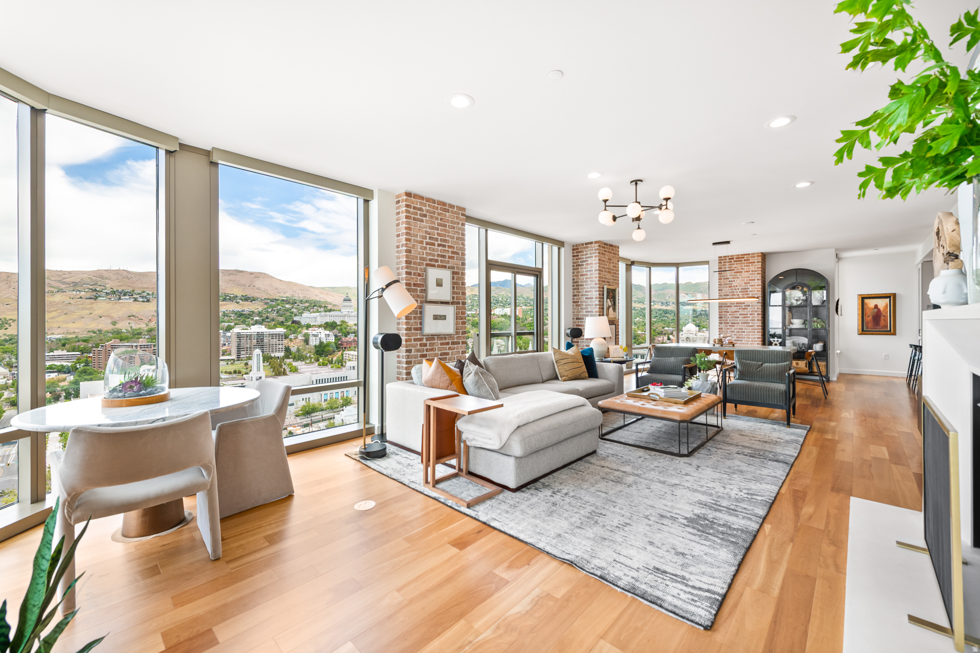 A rare opportunity to own one of the most sought-after residences in Salt Lake City's premier residential address, Residence 2206 at 99 West is an offering that seldom becomes available. In fact, this coveted 3-bedroom layout has not been offered since 2021 - a testament to its desirability and enduring appeal. Positioned high above the city on the 22nd floor, this exceptional 3-bedroom, 2-bath residence captures sweeping panoramic views through dramatic floor-to-ceiling glass, blending refined contemporary design with timeless architectural elegance. Expansive living and dining spaces are thoughtfully designed for both sophisticated entertaining and everyday comfort, while the primary suite is perfectly oriented to showcase the residence's most spectacular vistas. Natural light pours into every room, creating a warm, elevated atmosphere throughout. True three-bedroom residences within 99 West are extraordinarily limited, offering a level of flexibility rarely found in downtown luxury living - ideal for guest accommodations, a private office, media room, or additional lounge space. Refined finishes and understated luxury echo the building's signature aesthetic, creating a home that feels both sophisticated and effortlessly livable. Residents of 99 West enjoy a private, secure lifestyle in the heart of City Creek Center, with amenities that include: on-site management, secured access, fitness facilities, owner storage, bicycle storage, social spaces, and direct access to City Creek's spa and pool amenities. Just outside your door awaits Salt Lake City's finest dining, shopping, arts, and cultural experiences. Residence 2206 is more than a home - it is a rare chance to own within one of downtown Salt Lake City's most prestigious towers. Opportunities of this caliber are few and far between. Square footage figures are provided as a courtesy estimate only and were obtained from the building architect. Buyer is advised to obtain an independent measurement.