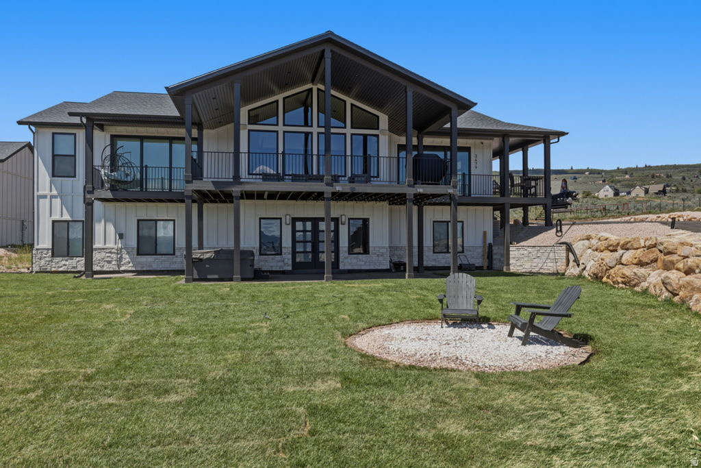 Turnkey luxury Bear Lake retreat built by a custom home builder and only a few months old. Sold fully furnished with over $100K in high-end furnishings, plus a new hot tub included. Walk in and be wowed. Exceptional finishes and quality craftsmanship throughout, this home is designed for both comfort and strong rental potential. The bright open-concept layout features upscale materials, expansive gathering spaces perfect for entertaining, and a premium sound system. Huge windows frame stunning lake views while filling the home with natural light. Multiple spacious bedrooms and inviting living areas accommodate large groups, making it ideal as a vacation home or short-term rental.Everything in the home stays with the exception of the ATV and jet skis in the garage. Located in a premier year-round recreation area with easy access to boating, beaches, trails, and winter activities.Oversized garage offers abundant space for boats, ATVs, and outdoor equipment. Ideal as a private getaway, investment property, or combination of both. See attached builder floor plans. Buyer to verify all information.