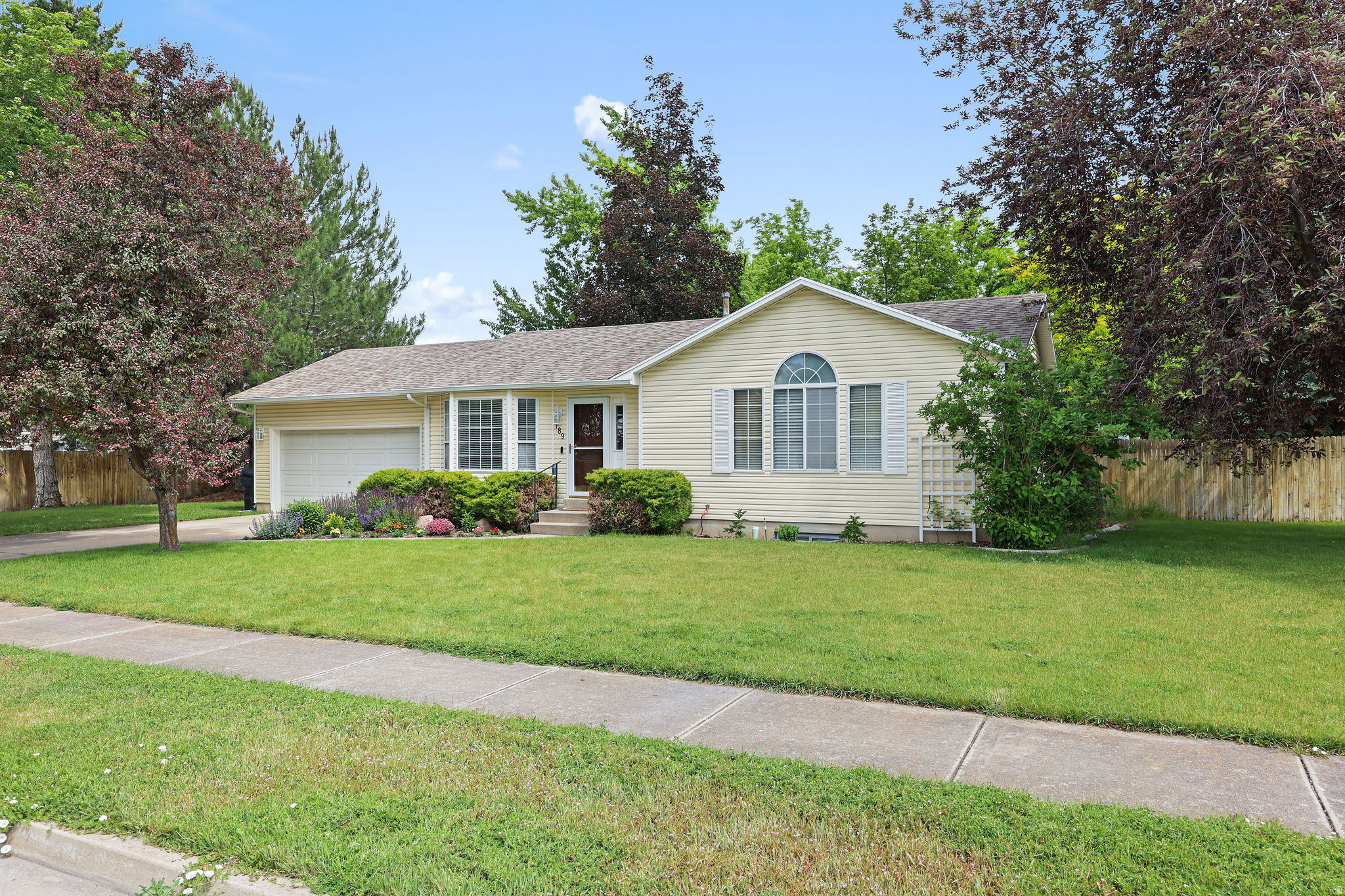 Come see this beautiful, meticulously-maintained home in the heart of Smithfield with many updates. The furnace/ac replaced in 2023, most of the flooring updated in last 3 years, master bathroom and upstairs guest bath remodeled including quartz countertops 2024, water softener in 2025, large back yard with mature trees great for entertaining with back fence being replaced right now. Laundry on main floor for single level living. Close to shopping, parks, schools and hiking. Schedule a showing today!