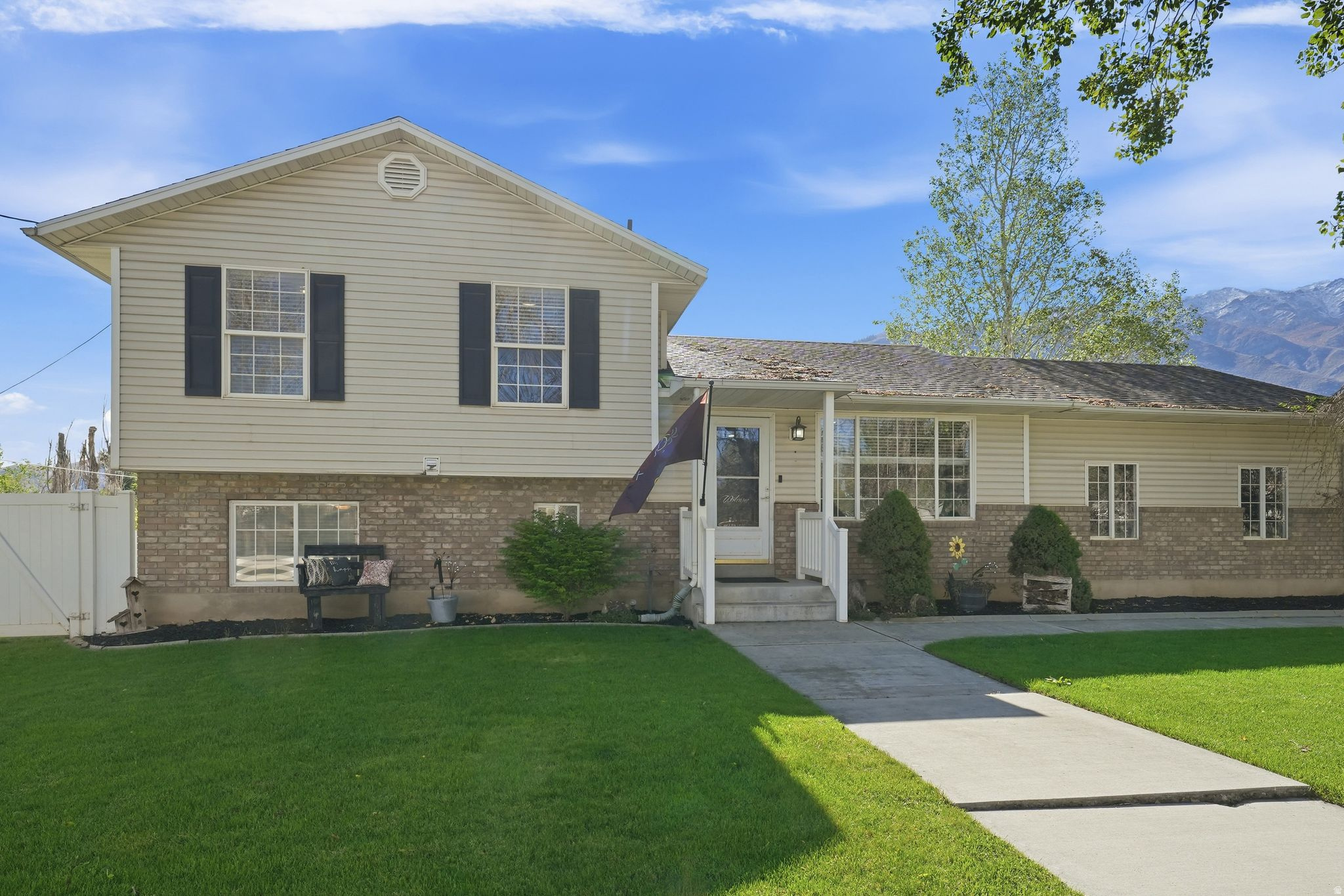 Nestled in a quiet Santaquin neighborhood on a spacious half acre lot, this two story home offers 5 bedrooms and 1,998 sq ft of living space, with beautiful mountain views and a flexible layout that provides room to grow, work, and unwind.  Inside, you'll find a comfortable, functional floor plan with recent updates that make day to day living easy. The kitchen features several thoughtful improvements that enhance both style and usability, and a 2023 roof replacement adds peace of mind, blending solid 1990s construction with an important modern upgrade.  Outside is where this property really shines. The large half acre lot offers room for gardens, pets, play, or future projects, complemented by a covered patio and awning that create a shaded outdoor living area ideal for BBQs or quiet evenings - with a nice hot tub included! With its peaceful setting, outdoor space, and hard to find five bedroom design, this Santaquin home stands out as a versatile option for a wide range of lifestyles.  Square footage figures are provided as courtesy estimates only and were obtained from county records. Buyer is advised to obtain an independent measurement.