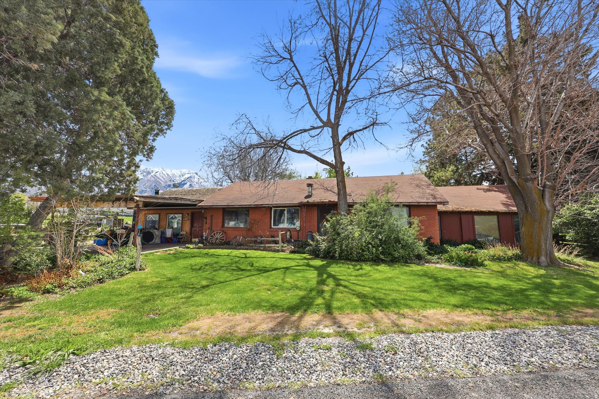 Views, land, and opportunity. 4.22-acre property in Salem with two homes, fully fenced and zoned for animals. Flat, usable land with mountain views and a rare two-home setup. Ready for renovation, rebuild, or a fresh start.   The main home (2 bed, 1 bath, approx. 2,277 sq ft) is in need of a full renovation or rebuild, while the second home provides additional flexibility for guest space, rental potential, or future plans.   The acreage is flat, usable, fully fenced and zoned for animals, giving you a head start on creating the setup you've been looking for. The property is serviced by a well (re-drilled in 2000 to 320 feet) and includes 10 water shares, adding long-term value and functionality.   Located in a growing area of Salem, you get the best of both worlds, space to spread out with convenient access to nearby amenities.   If you've been looking for land with flexibility, views and real potential, this is a rare opportunity to make it your own.