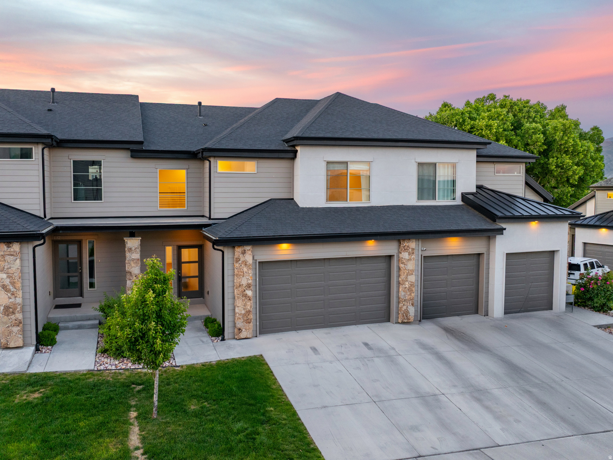 The #1 frustration buyers have with townhomes is 99% of them don't have backyards... Well, that's not the case with this one! There's a HUGE grassy park behind your future home and the best part is you don't have to maintain any of it! Even the grass in your fenced in area is handled by the community. After you're finished hanging out in your secluded backyard, you'll also love the elevated finishes inside with the upgrades like the designer lighting, metal railings and custom carpentry accents on the wall. Wait until you see the unobstructed views of the mountains and park in your backyard (instead of your neighbors' garages like most congested townhomes)! This townhome is in the top 1% and has your name all over it. Call/Text the listing agent anytime to check it out!