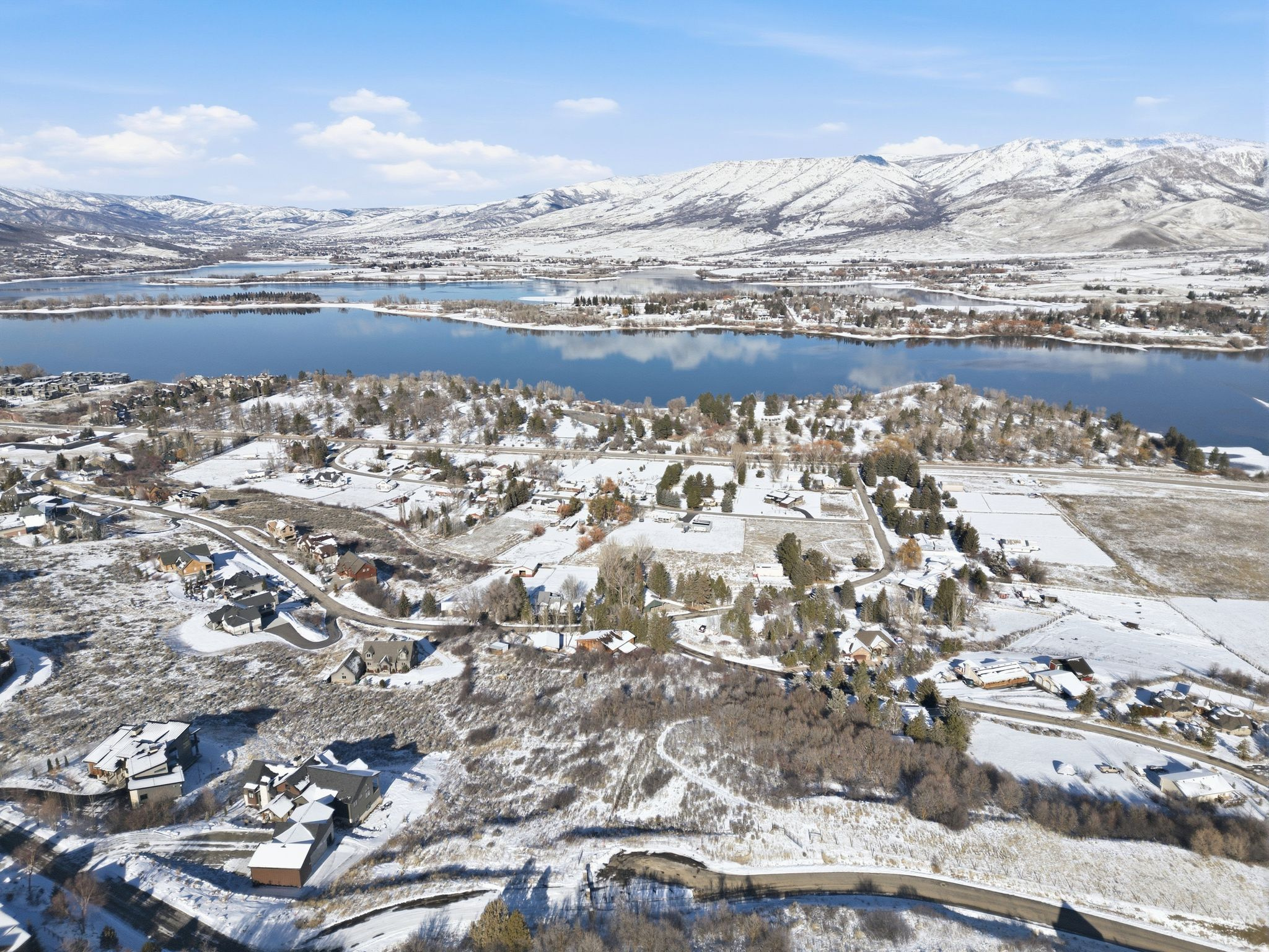 Gated Mountain Lot, Panoramic Views, Minutes to Pineview and Skiing. A gracious 1.03 acre building lot in the gated Summit at Ski Lake community, is ready for your dream home. Elevated for privacy and big mountain views, this lot delivers true high-country peace without giving up access to anything.  Located in Huntsville about one hour away from the Salt Lake City International Airport. Spend summers on Pineview Reservoir and winters at Snowbasin, Powder Mountain, or Nordic Valley, all spectacular destinations. Design the mountain home you have been waiting for in a setting that feels worlds away yet anchors you to happiness. Buyer to verify all information, boundaries, and documents.