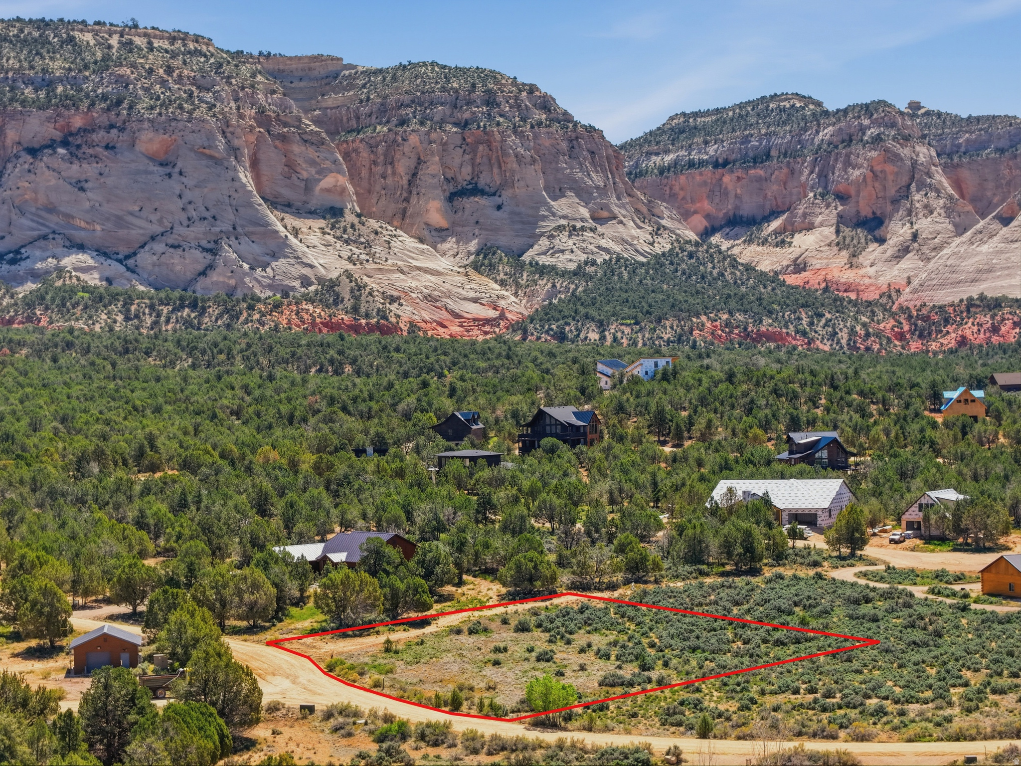 Discover an exceptional opportunity to create your dream cabin retreat within the exclusive Quarter Circle H Subdivision. This elevated 1.05 acre homesite is surrounded by pristine natural terrain, offering a rare blend of privacy, tranquility, and unobstructed beauty. Enjoy breathtaking 360-degree views-from the striking White Cliffs to sweeping valley vistas, perfectly positioned for a custom build that captures the scenery from every angle. With year-round access and short-term rentals (Airbnb/VRBO) permitted, this property offers both convenience and investment potential. Protective covenants (CC&Rs) are in place to preserve the area's peaceful, country-living atmosphere while still being within reach of modern amenities. Ideally located just 20 minutes from Zion National Park, 1 hour from Bryce Canyon National Park, 20 minutes from Coral Pink Sand Dunes, and near Best Friends Animal Society-this is your opportunity to own a piece of Southern Utah's incredible landscape. (Buyer to verify all)