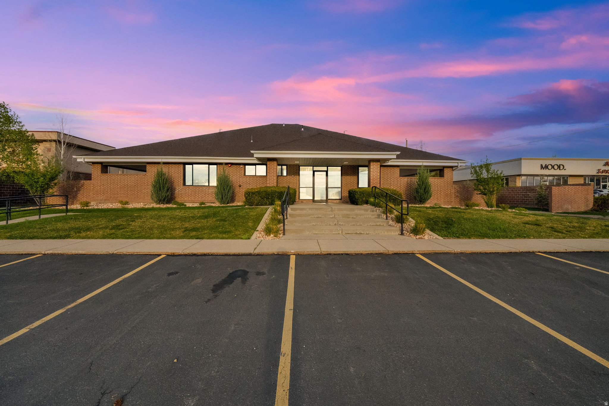 Premier Fully Remodeled Office Headquarters with a Warm, Home-Like Feel. This well-appointed office building in a prime Sandy, Utah location, offering outstanding visibility and convenient freeway access. This approximately 10,000 square foot property is situated on a full 1-acre lot and presents a rare blend of private offices, collaborative workspace, and executive-level amenities. The interior has been thoughtfully upgraded throughout, featuring new windows, flooring, electrical, plumbing, HVAC systems, roof, bathrooms, lighting, cabinetry, a modern key-card security system and landscaping. The flexible layout includes many options for the spaces, conference rooms, and two expansive bullpen areas-ideal for growing teams or dynamic business operations. Enhanced soundproofing throughout the building creates a quiet, focused environment with increased privacy, making it especially well-suited for professional and client-facing businesses. Designed to support both productivity and workplace culture, the building offers a full kitchen, two additional kitchenettes, multiple lounge areas, and a dedicated game space. Four executive offices are further enhanced with private decks, delivering a distinctive and elevated professional environment. The layout and amenities lend themselves to a wide range of professional uses, including medical or wellness practices, counseling, therapy, psychology, social work, and other service-based businesses. The property's prime location places it within a vibrant corridor of dining, shopping, and hotel amenities, providing convenience for both employees and clients, as well as opportunities for meetings and after-hours engagement. The exterior provides ample parking, new landscaping, and a grass area, creating strong curb appeal and a welcoming setting. This is an excellent opportunity for an owner-user or investor seeking a versatile, turnkey office property in a highly desirable and accessible location. Schedule today to tour the building.