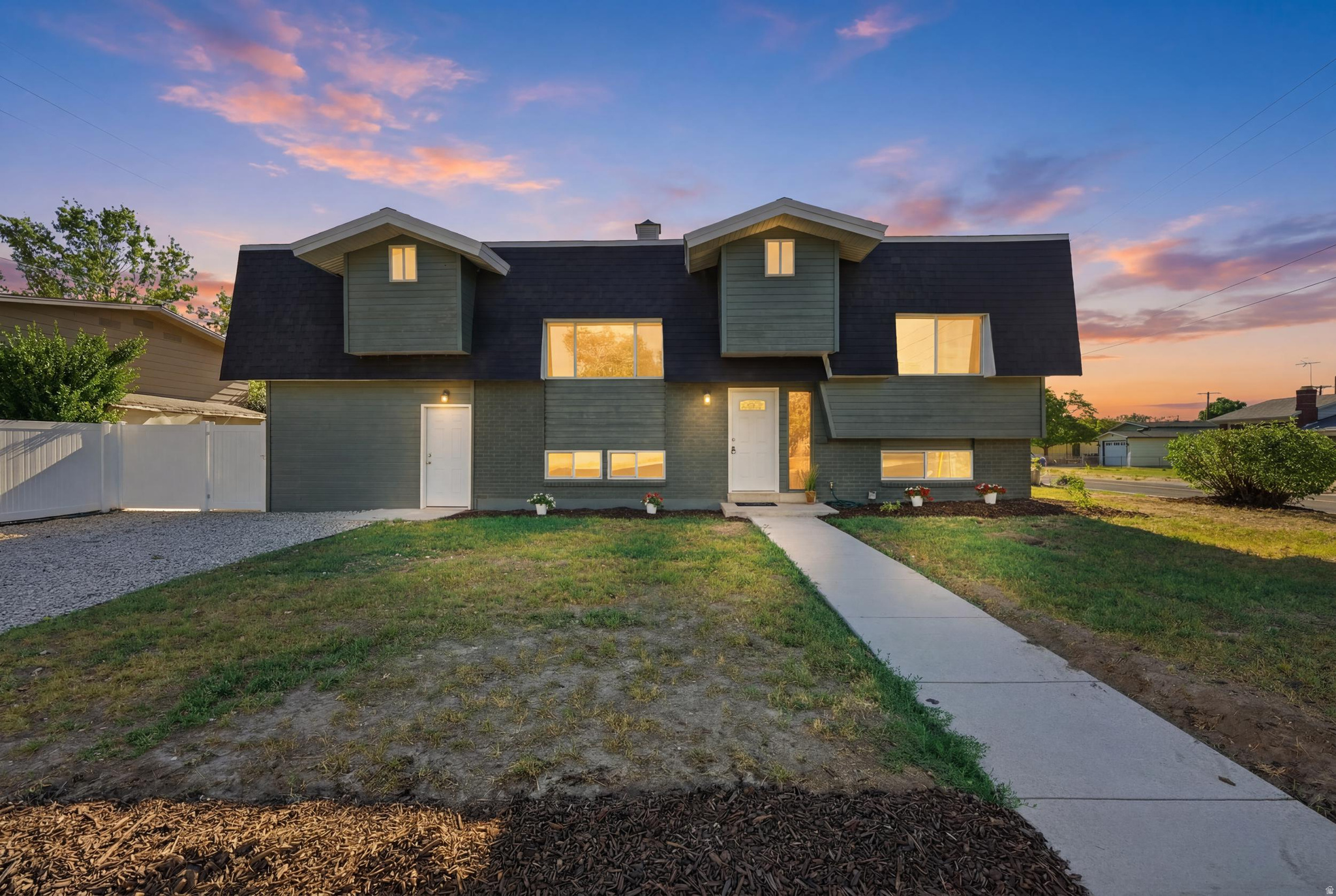Completely reimagined and filled with natural light, this expansive Taylorsville home offers exceptional space, thoughtful design, and quality finishes in a mature, established neighborhood. Large windows and dramatic skylights create light, bright interiors, while oversized rooms provide an open, welcoming atmosphere throughout. Both renovated kitchens feature new quartz countertops, abundant soft-close cabinets and drawers, updated fixtures, and generous workspace for cooking, gathering, and entertaining. Beautifully remodeled bathrooms showcase custom tilework, new vanities, modern fixtures, and carefully selected finishes, while new flooring gives the home a fresh and cohesive look. The extensive renovation goes well beyond the surface, with extensive new electrical and plumbing, new HVAC systems, new water heaters, and a newer roof. Spacious bedrooms, multiple gathering areas, and a massive laundry room provide exceptional comfort, storage, and everyday functionality. A separate living space includes its own beautifully appointed kitchen, living area, bedrooms, bathroom, laundry, and walk-in closets. This versatile arrangement offers excellent flexibility for multigenerational living, extended-stay guests, home offices, a private secondary living area, or potential rental income. The oversized garage offers extra width and depth for vehicles, tools, recreational equipment, a workshop, or additional storage. Dedicated RV parking adds even more versatility. Set on a corner lot, this home pairs the character of an established neighborhood with the style, comfort, and major system improvements of a substantial renovation. The renovation work was completed with city permits. Spacious, versatile, and beautifully updated, this home feels even more impressive in person.