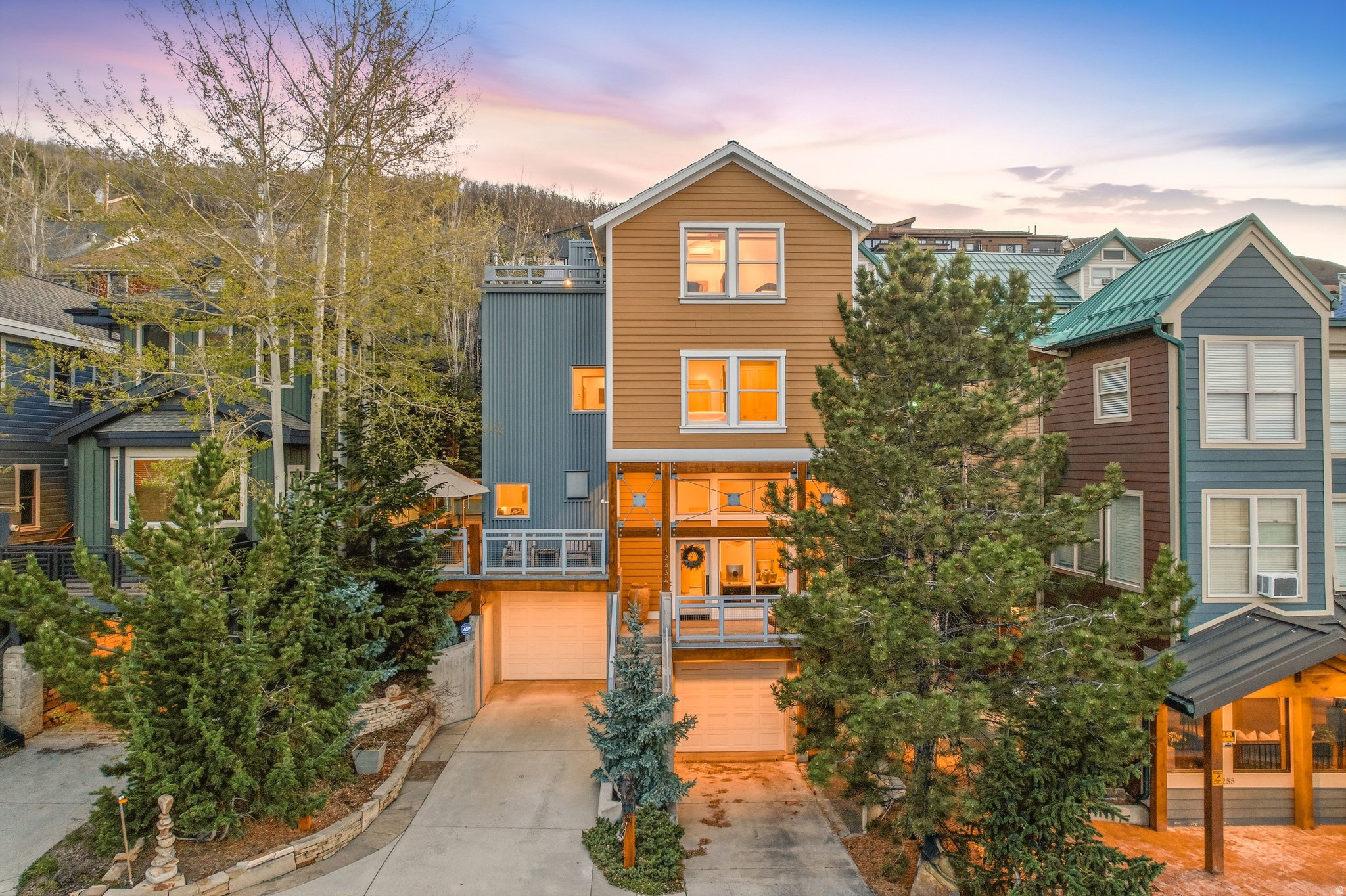 Stairway to Heaven. Perfectly positioned in the heart of Old Town, this exceptional home offers a rare private walkway and staircase directly to Park City Mountain-an experience few properties can match. With skiing just steps away and Main Street within easy reach, the location is truly unmatched. Thoughtfully designed with 3 bedrooms and 4 bathrooms, the home is filled with warmth, character, and intention. Three expansive decks capture breathtaking views, while three fireplaces create inviting spaces to gather and unwind. Inside, rich materials and distinctive design elements-such as the striking concrete wall and beautifully crafted kitchen with concrete countertops-give the home a refined, one-of-a-kind feel. Large balconies with folding door systems seamlessly connect indoor and outdoor living, allowing you to fully enjoy the surrounding mountain setting. After a day on the slopes, relax in the private hot tub or return to the comfort of your heated garage. Two street parking passes in Zone G, one for the owner and one for a guest is also included. This is a home that has been deeply cared for and thoughtfully curated-offering an extraordinary combination of design, setting, and lifestyle in one of Park City's most sought-after locations.   Square footage figures are provided as a courtesy estimate only and were obtained from county records.  Buyer is advised to obtain an independent measurement.