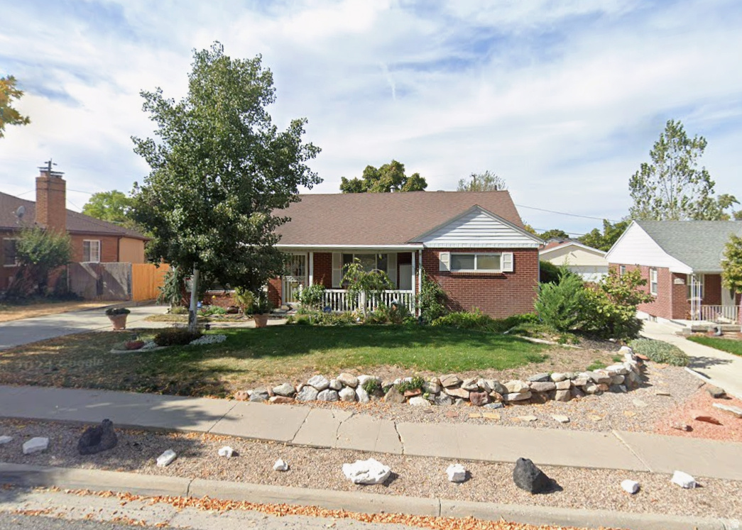 Charming Millcreek rambler offering inviting living spaces filled with character. The spacious living room features beautiful hardwood floors and a stunning rock fireplace, creating a warm and welcoming atmosphere. The updated kitchen boasts granite countertops, stainless steel appliances, and a built-in china hutch, blending style with functionality. The home includes 3 bedrooms and 1 bathrooms on the main level. Downstairs, the large walk-out basement provides exceptional additional living space with a generous family room, an additional bedroom and bathroom, plus abundant storage. Step outside to enjoy the covered deck overlooking the beautifully landscaped yard. A detached 2-car garage completes this wonderful property. Updated wiring and plumbing. Newer HVAC and water heater. Conveniently located near parks, shopping, dining, and freeway access, this Millcreek gem is one you won't want to miss!