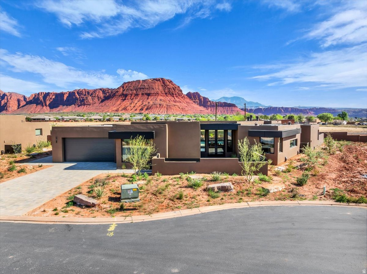 Experience luxury living at it's finest in this brand new, custom built masterpiece. Showcasing breathtaking views of the majestic Red Mountains. This stunning residence boasts a private pool that is 37 X 17 with 3 spill ways, accent planter and integrated spa. Enjoy relaxing by the fire pit with built in benches. The heart of the home is the gourmet kitchen with panel ready thermador refrigerator/freezer and dishwasher, matte black stainless steel Zline cook top, double oven and microwave. Each bedroom offers its own walk in closet. The home also features a dedicated pool room and a casita with a private exterior access complete with a full sized kitchenette, ideal for guests or extended living.This exceptional property offers the ultimate luxury living experience.