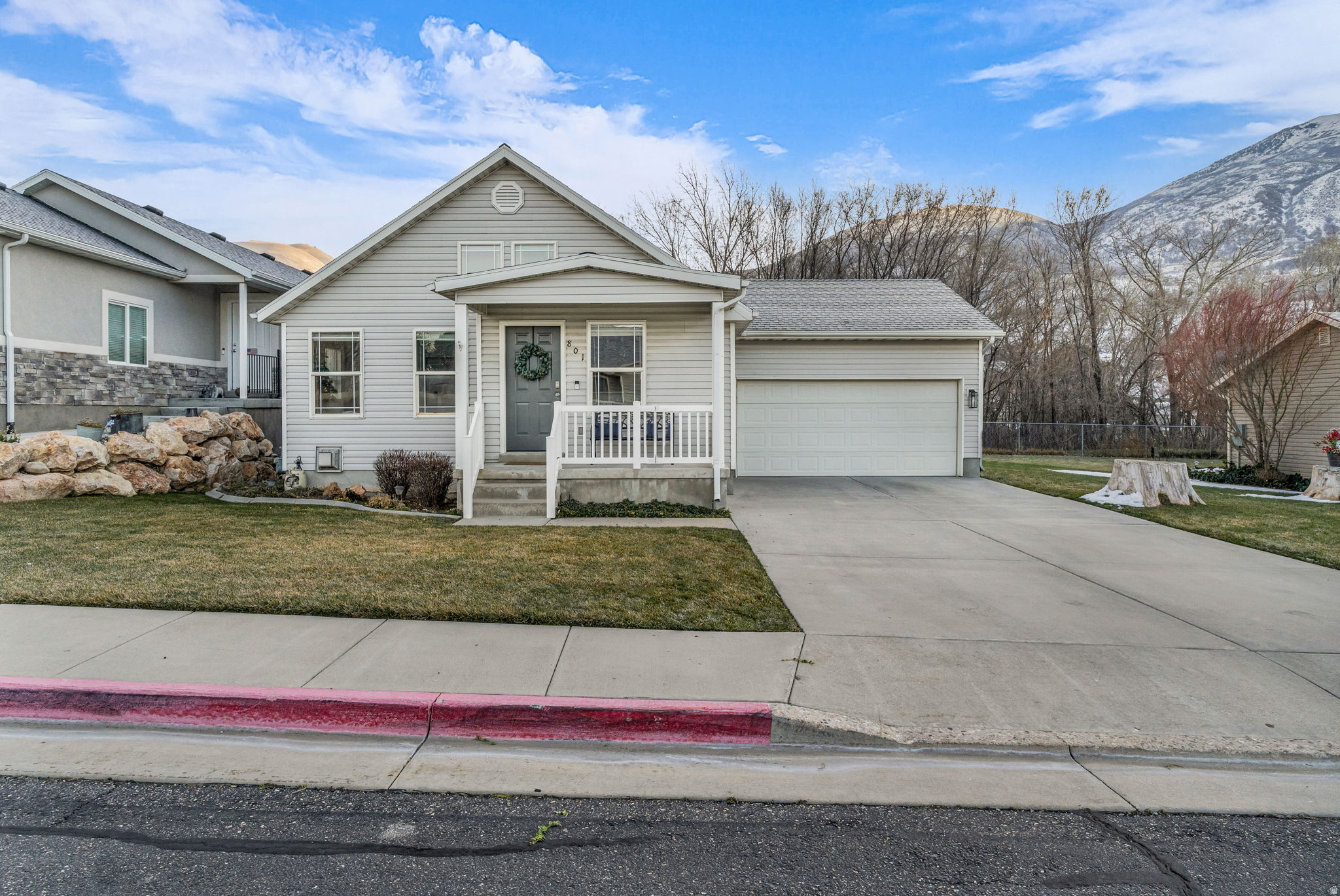 This beautifully maintained home with a fully finished basement has it all! Featuring five bedrooms, three bathrooms, two family rooms, and an office/flex space, there's plenty of room for everyone. The main-level family room offers vaulted ceilings and abundant windows that fill the home with natural light, while the oversized basement family room includes a cozy fireplace perfect for relaxing. The spacious primary bedroom provides a comfortable retreat. Thoughtfully updated throughout, the home features fresh interior paint, new countertops, sinks, and faucets in the kitchen and all three bathrooms, a new range and microwave, new carpet, new tile on the main level, and all-new light fixtures. The furnace and A/C were replaced in 2020, and ample storage can be found throughout the home. One of the standout features is the backyard location backing directly to Eagle Mountain Golf Course, providing beautiful views and added privacy with no rear neighbors. Enjoy low-maintenance living with an HOA that covers all landscaping, including sprinkler maintenance and snow removal all the way to the front porch, allowing you to spend more time enjoying your home and less time maintaining it.