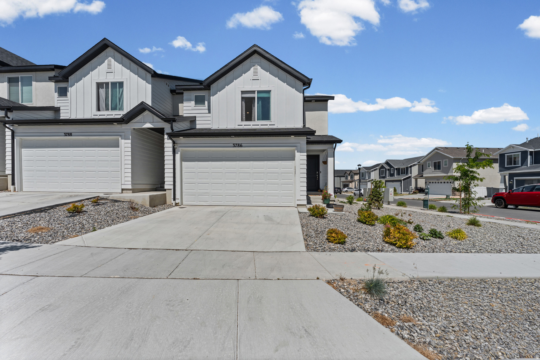 Come see why this community boasts the absolute best views in Salt Lake County! Perfectly tucked away in the quietest, most private section of the community right against the majestic Oquirrh Mountains, this pristine Millbrook townhome offers an unbeatable mountain backdrop. Completed in June 2024, this almost brand-new construction home is entirely turnkey and features a bright, spacious open-concept layout. The main living area flows seamlessly with durable laminate flooring, beautiful quartz countertops, and premium stainless steel appliances. An incredible opportunity like this won't last long in this market-hurry and schedule your tour today before it's gone! Buyer to verify all information.