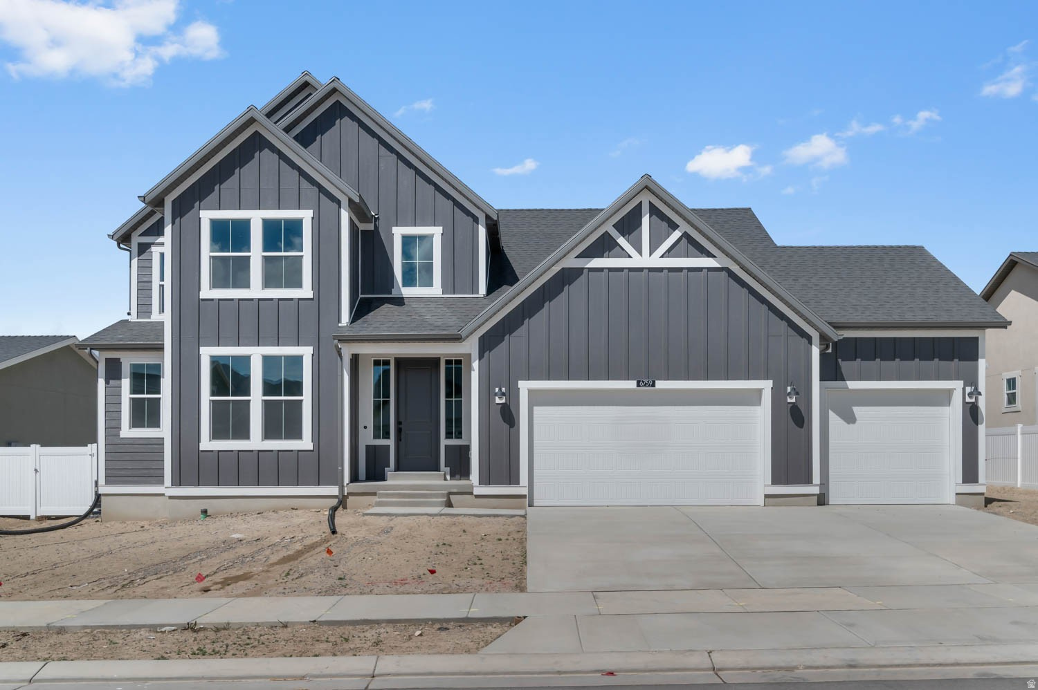 This beautiful 2400 Farmhouse-style home offers a spacious and thoughtfully designed layout with modern finishes throughout. The kitchen is a standout feature with Cotton Maple cabinetry, quartz countertops, a stylish tile backsplash, and platinum gas appliances-perfect for cooking and entertaining. A charming box window in the kitchen nook brings in natural light and adds to the home's inviting feel. Enjoy a blend of laminate hardwood, tile, and plush carpet flooring, complemented by recessed can lighting and convenient Christmas light outlets. Energy-efficient features, including a tankless water heater, enhance comfort and help reduce utility costs. The home showcases upgraded design elements such as a sleek metal stair railing, two-tone paint, and large Craftsman-style baseboards and door casings. The spacious owner's suite offers a spa-like retreat with cultured marble shower surrounds, Euro glass doors, and modern black matte hardware for a contemporary touch. This home perfectly combines farmhouse charm with stylish upgrades and functional living spaces, a perfect ready to move  in home!