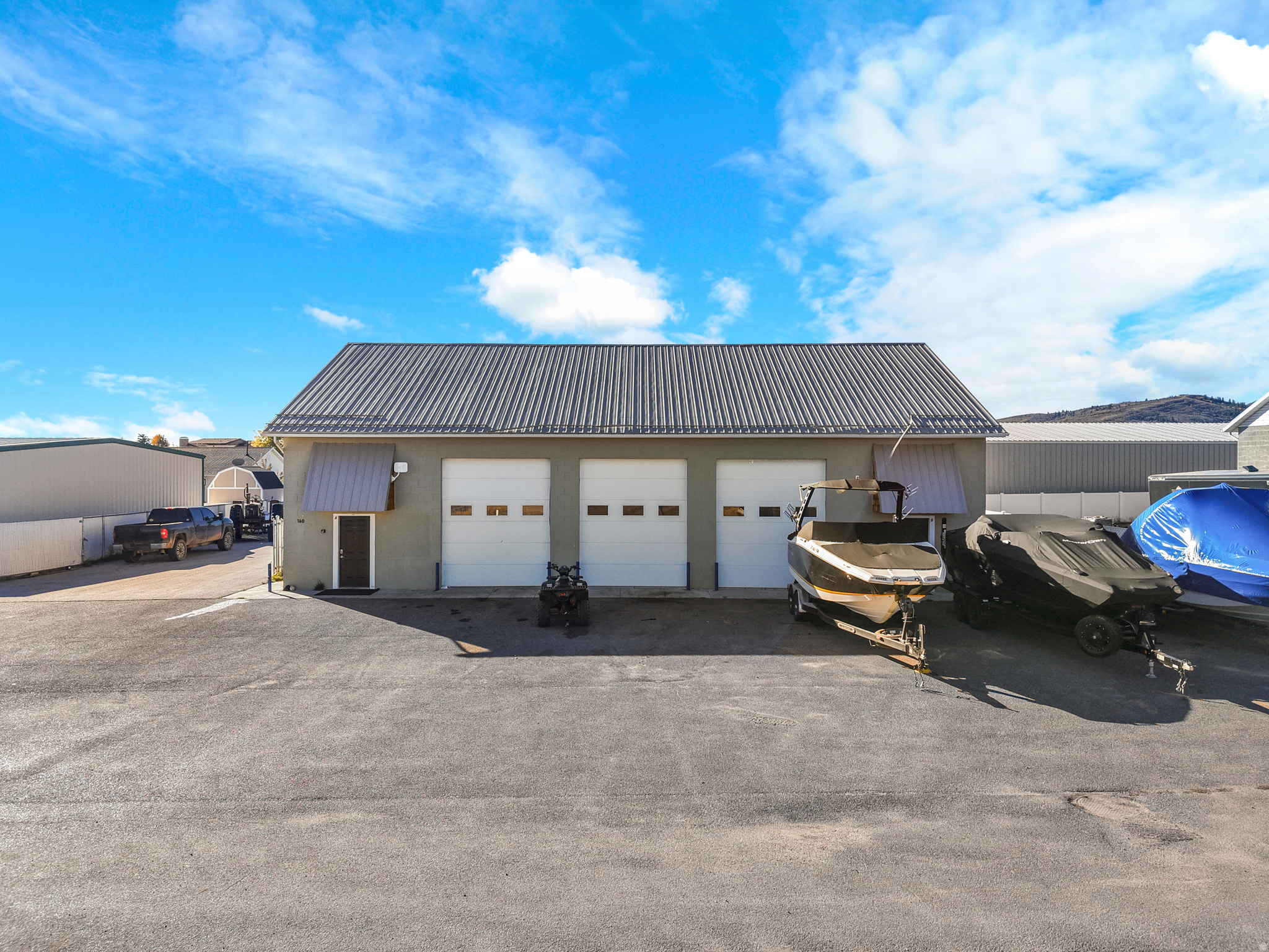 Prime Bear Lake Commercial Opportunity! Two versatile office/warehouse buildings totaling 10,155 sq. ft. in the heart of Garden City. Perfect for light industrial, office, or storage uses, with flexible configurations for owner-use or income potential. The first building (built in 2005, 4,155 sq. ft.) features 18-ft ceilings, two offices, two restrooms, and the ability to divide into up to three units-two with office/restroom spaces and one rear warehouse. Includes three 12' x 12' and one 10' x 12' overhead doors (all with openers). The second built in 2018 offers 6,000 sq. ft., 60' x100'  of open, adaptable space ideal for warehouse, storage, or additional business use, with 2 14' high x 20' wide oversized garage doors Paved parking in front, on the side, and and back with 40 parking spaces. Drainage sub-station installed for washing. High-visibility location and multiple building access points make this an excellent investment or owner-user opportunity in a fast-growing Bear Lake market.