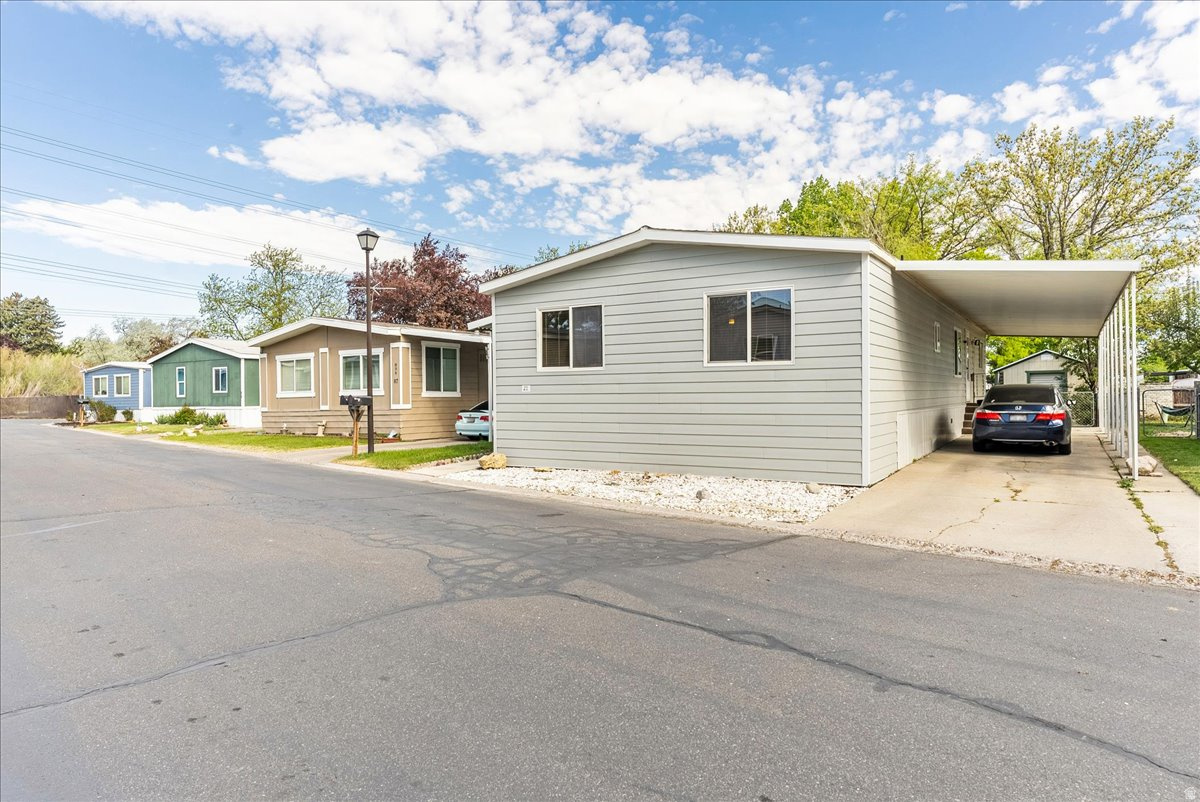 Spacious 1,440 sq ft manufactured home. You will feel the size immediately upon entering with an open floor plan, oversized bedrooms, and a large kitchen island that flows into a spacious semi formal dining area. This well maintained home features insulated siding with added R value, durable aluminum skirting, and a newer roof approximately 5 years old. Mechanical updates include a newer furnace installed approximately when the current owner purchased the home, an A C condenser approximately 2 years old, and a water heater replaced approximately 5 years ago. Interior improvements include updated Simonton windows in the living room and kitchen installed approximately 3 years ago. The property also includes an impressive storage shed with power and lighting, featuring a heavy duty metal roll up door with secure locking capability. Community amenities include access to a clubhouse. Buyer to verify all information.  Square footage figures are provided as a courtesy estimate only and were obtained from recent appraisal.  Buyer is advised to obtain an independent measurement.