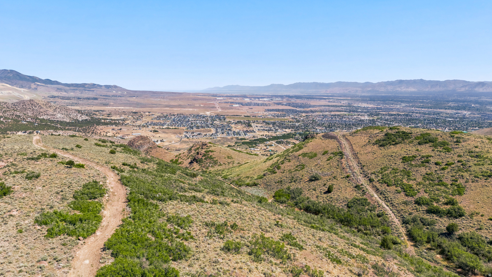 Rare opportunity to own 11.74 acres of buildable land in the sought-after Hi Country community. Perched above the valley, this exceptional property offers breathtaking panoramic views of Herriman, the Salt Lake Valley, and surrounding mountains.  * Please reach out for drone video for better look.  Build your custom dream home and enjoy unmatched privacy, open space, and stunning sunrises and city lights. With plenty of room for horses, outbuildings, and recreational opportunities, the possibilities are endless.  Experience the perfect balance of mountain living and convenience, just minutes from shopping, schools, dining, and major roadways. Large acreage view lots like this are increasingly rare-don't miss your chance to own one of Hi Country's premier properties.