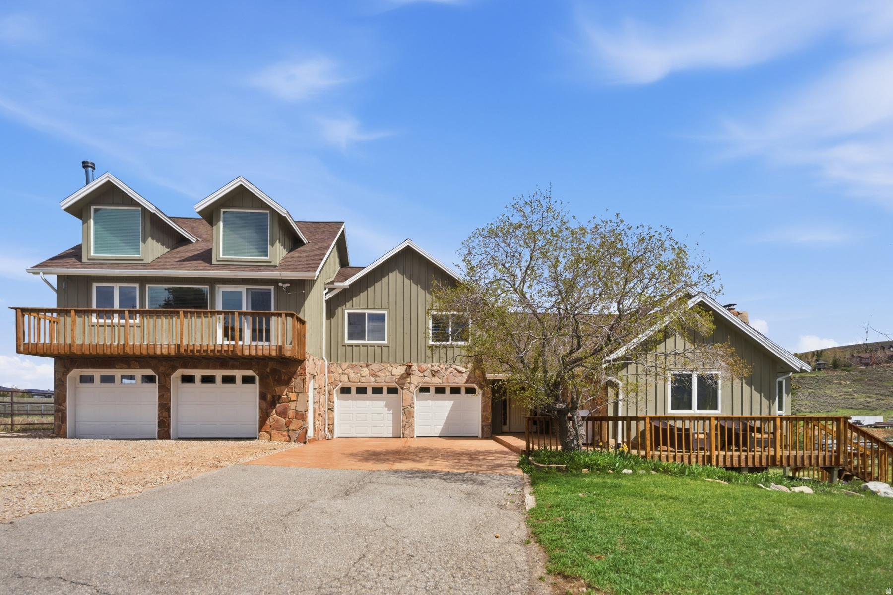 When a rare Old Ranch Road horse property hits the market, everyone pays attention-and this one truly stands out. Impeccably maintained and thoughtfully updated, this 2 acre estate offers a remarkable blend of function, flexibility, and mountain serenity. The property features three kitchens, three laundry areas, use the entire home or plenty of private space for guests. A 5 car garage, pasture, arena, a 4 stall barn, and two additional outbuildings, giving the next owner endless possibilities for living, hosting, and creating. Backing to open space, the setting is peaceful and private with room to breathe. Enjoy elevated deck spaces and a spacious patio-perfect for outdoor dining, sunset watching, or simply taking in the views of The Swaner Preserve, Deer Valley Ski Resort, Park City Mountain Ski Resort, and The Canyons Ski Resort creating the most breathtaking views. Your horses can graze in their fully fenced area enjoy hiking, biking, and horseback riding trails, including the incredible Round Valley trail system, which is located behind the property, this is a dream for outdoor enthusiasts. A truly one of a kind property with a warm, soulful feel that welcomes you the moment you arrive. There is so much amazing opportunity with this one-of-a-kind home.