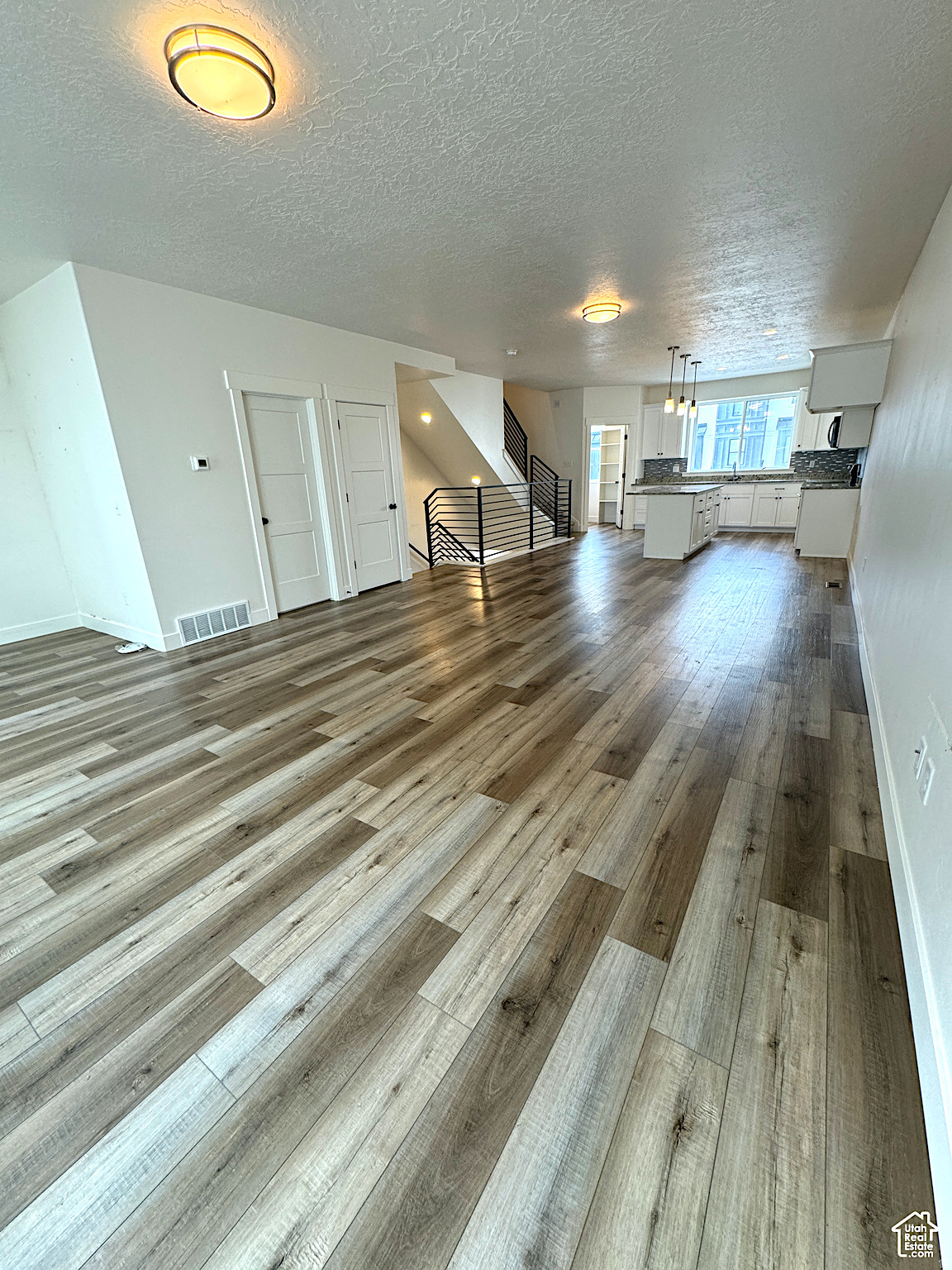 Beautiful townhome in CK Farms in American Fork with stunning mountain views! This light-filled home features thoughtful upgrades throughout, including designer accent walls, upgraded lighting, and a modern metal railing. The kitchen is a standout with quartz countertops, a gas range, soft-close cabinetry, and an oversized pantry.  Enjoy the convenience of additional street parking along with quick freeway access. Ideally located near shopping, dining, parks, and everyday amenities.  Square footage figures are provided as a courtesy estimate only and were obtained from a previous listing. Buyer is advised to obtain an independent measurement.  No bank needed seller finance offered 15% down 7.5% interest with a five-year call with the 40 year amaffordable at $2908 P&I..