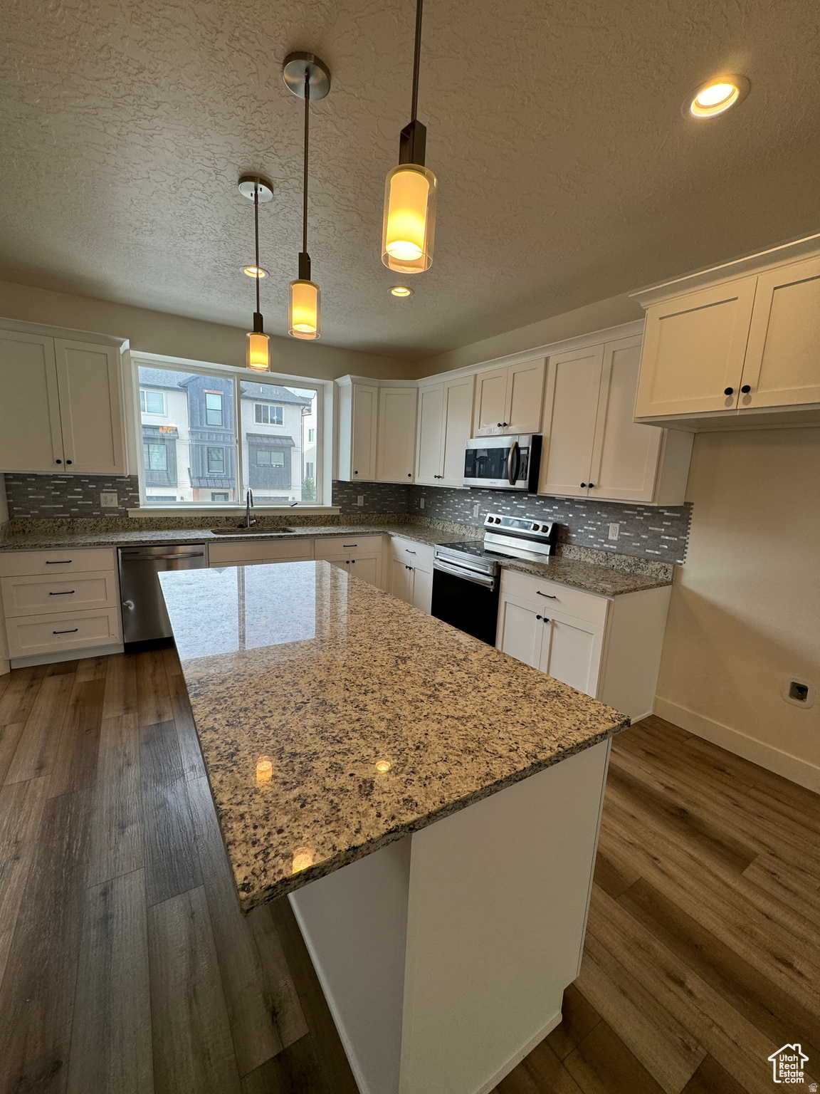 Beautiful townhome in CK Farms in American Fork with stunning mountain views! This light-filled home features thoughtful upgrades throughout, including designer accent walls, upgraded lighting, and a modern metal railing. The kitchen is a standout with quartz countertops, a gas range, soft-close cabinetry, and an oversized pantry.  Enjoy the convenience of additional street parking along with quick freeway access. Ideally located near shopping, dining, parks, and everyday amenities.  Square footage figures are provided as a courtesy estimate only and were obtained from a previous listing. Buyer is advised to obtain an independent measurement.  No bank needed seller finance offered 15% down 7.5% interest with a five-year call with the 40 year amaffordable at $2908 P&I..