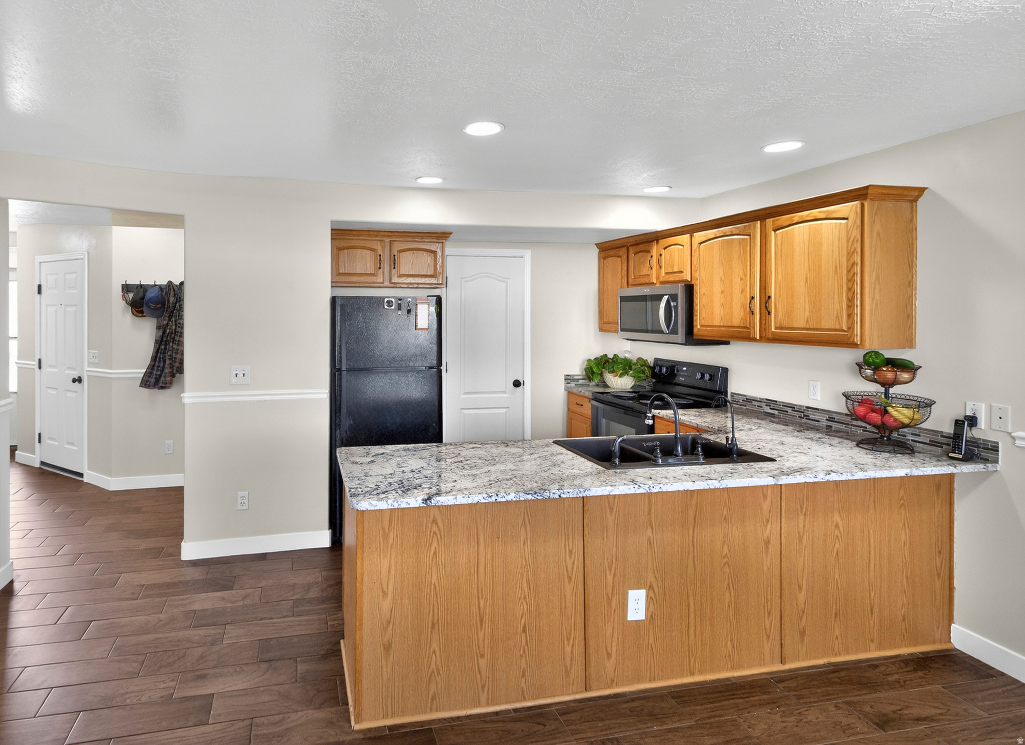 This home is so light and bright! Welcome to 802 Sugar Maple Ct., a well-appointed townhouse-style condo offering comfort, functionality, and low-maintenance living in the heart of Payson. This 3-bedroom, 2.5-bath home features a bright and inviting layout with both front and rear entrances, allowing for abundant natural light and refreshing cross-breezes throughout the day.  The main living area flows seamlessly into the kitchen and dining space, creating an ideal setting for everyday living and entertaining. Fresh new carpet enhances the interior, while the spacious 2-car garage provides convenience and ample storage, including attic storage.  Enjoy access to a community playground and additional off-street parking-perfect for guests and flexible living.  See attached list of updates and maintenance schedule. Square footage figures are provided as a courtesy estimate only and were obtained from County Records .  Buyer is advised to obtain an independent measurement.