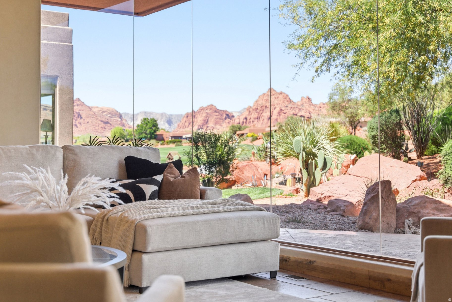 Set within the sought-after community ofEntrada at Snow Canyon Country Club, this home offers a rare position backing directly to the 7th tee box with unobstructed views stretching across the course and into Snow Canyon. The layout features 3 bedrooms and 3 bathrooms, designed for comfortable everyday living or easy hosting. Large windows bring in natural light and frame the surrounding landscape, creating a strong connection to the outdoors from nearly every space. Enjoy elevated desert living with striking lava rock, red mountain backdrops, and one of Southern Utah's most iconic golf courses right out your backyard.
