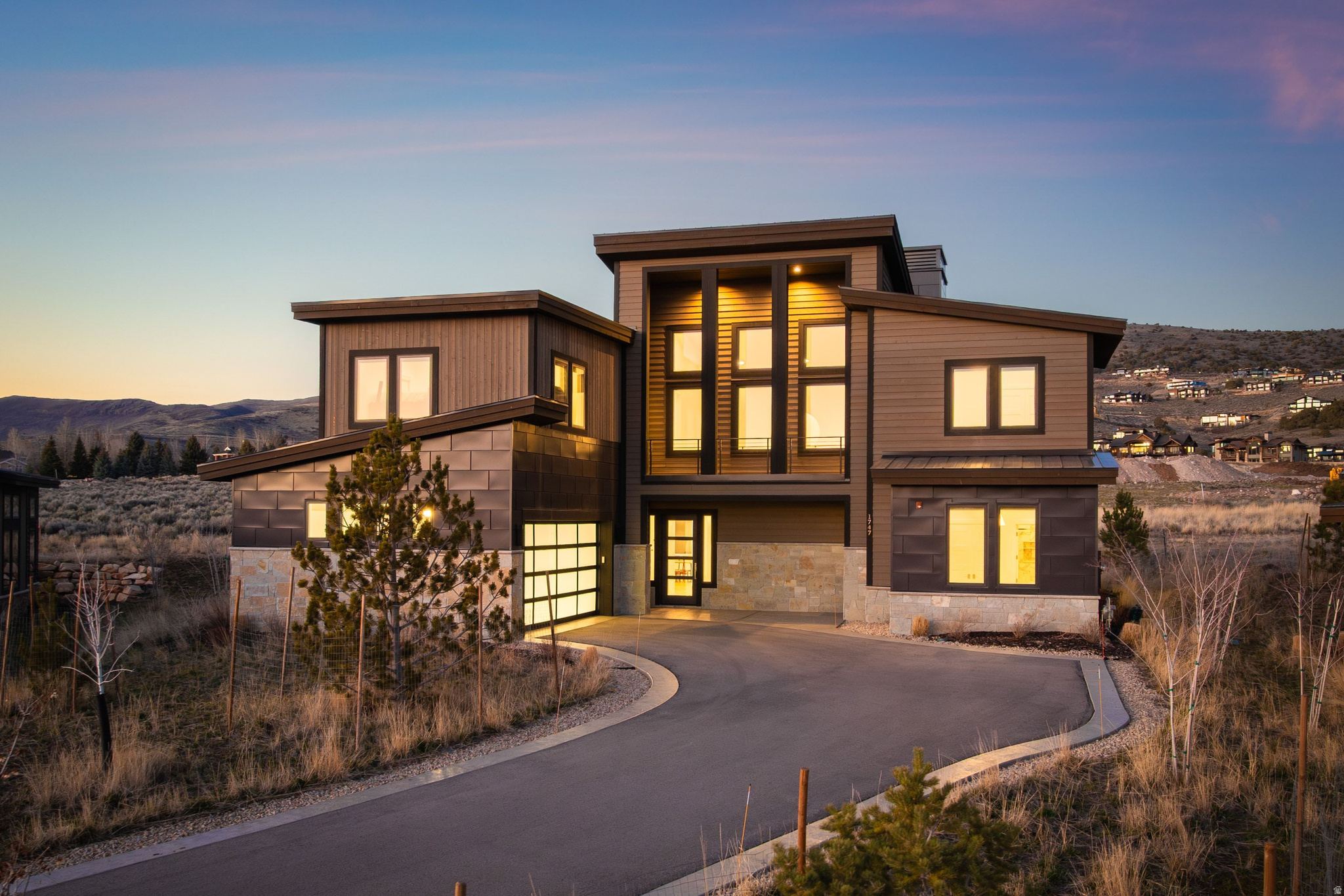 Wake to the Mountains. Gather in Comfort. Escape with Ease. With mountain views and thoughtfully designed living spaces, this five-bedroom home offers a setting that feels both private and comfortably connected to its surroundings.  The main level opens into a spacious great room, dining area, and kitchen that flow together naturally, creating an inviting environment for both everyday living and relaxed entertaining. The kitchen is equipped with Wolf appliances and outstanding butler's pantry complemented by refined finishes through the entirety of the home.  Four bedrooms feature private en-suite bathrooms, providing comfort and separation for family and guests alike.  For the younger guests, a bunk On the main level, the primary suite offers an elevated sense of retreat with a spa-inspired bathroom and heated floors. Mountain views from the second level and a well-designed outdoor living space create opportunities to unwind and enjoy the rhythm of mountain life in every season.  Located within one of Red Ledges' maintenance-free signature neighborhoods, the HOA manages landscaping and snow removal, making this an ideal option for those seeking a true lock-and-leave golf or ski retreat, or simply a low-maintenance way to enjoy the community's private club lifestyle.