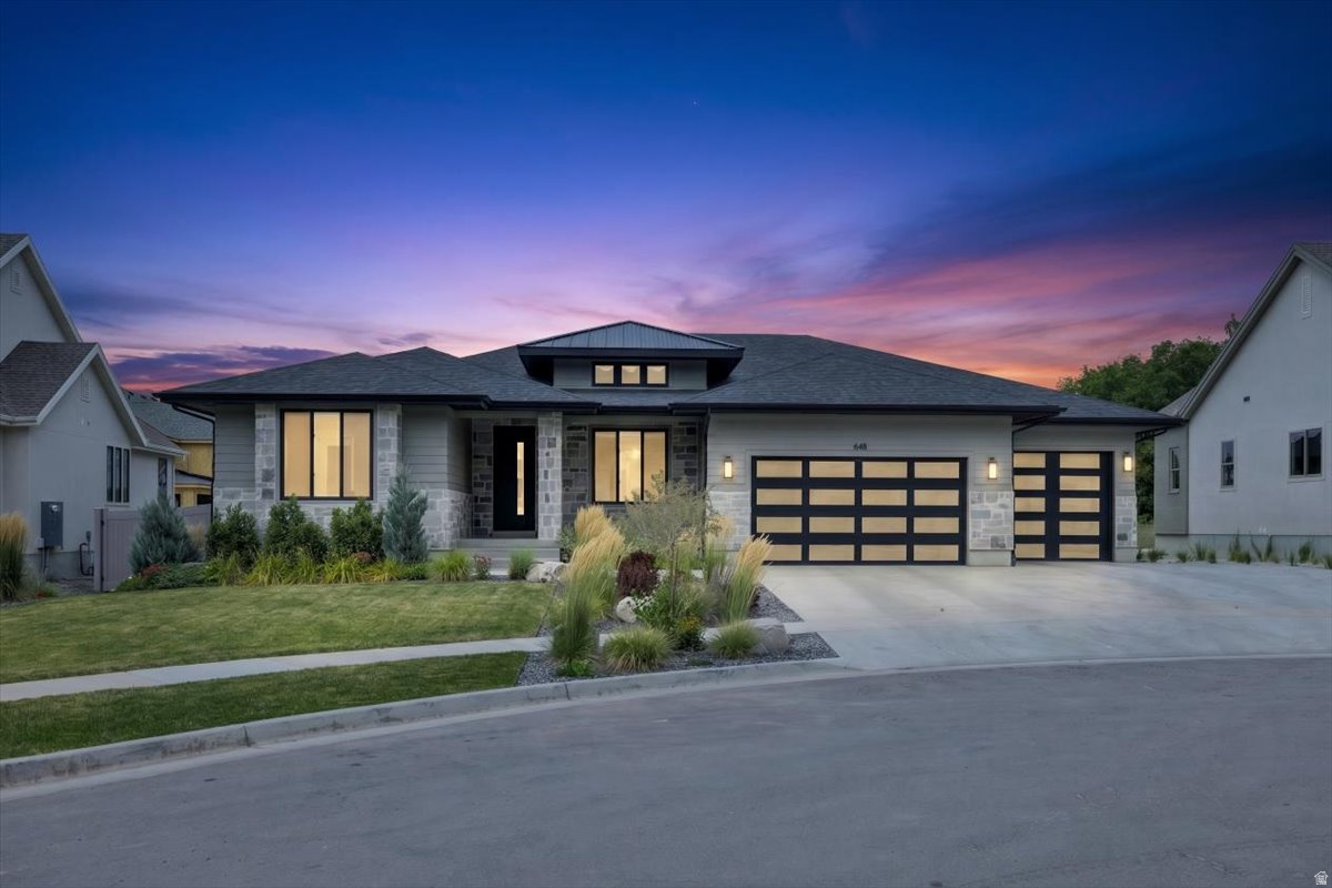 Modern Rambler in a Private Luxury Cul-de-sac Nestled in a private, high-end enclave, this modern rambler is a masterpiece of design and comfort. Spanning nearly 40,000 sq. ft., the Tenor floorplan built by Symphony Homes. Balances architectural elegance with everyday functionality and a stunning pool and full fencing now added, this is one of the most complete luxury packages on the market. Step inside to an open-concept layout with ceilings up to 12 feet and floor-to-ceiling windows that flood the home with natural light. The grand family room features a sleek fireplace and looks out over the meticulously landscaped .35-acre lot. The chef's kitchen delivers custom locally crafted cabinetry, quartz countertops, and a full butler's pantry with hidden outlets to keep the space clean and uncluttered. The master suite offers a spa-inspired ensuite with an oversized shower, dual shower heads, and bench seating. All 5 bedrooms and 3.5 bathrooms are finished to a high standard, and the fully finished basement adds serious entertaining space - complete with an open-concept theater setup, kitchenette, and room for any occasion. Outside, a massive covered deck connects to a hardwired gas firepit and paver landing. The fully fenced backyard offers privacy and security, while the pool makes this an easy choice for anyone who wants resort-style living at home. A three-car garage with extended tandem space handles the rest. Minutes from I-15, Smith's, Lagoon, Farmington Station, and Highway 89 - exclusive without being isolated. Schedule your private tour today.