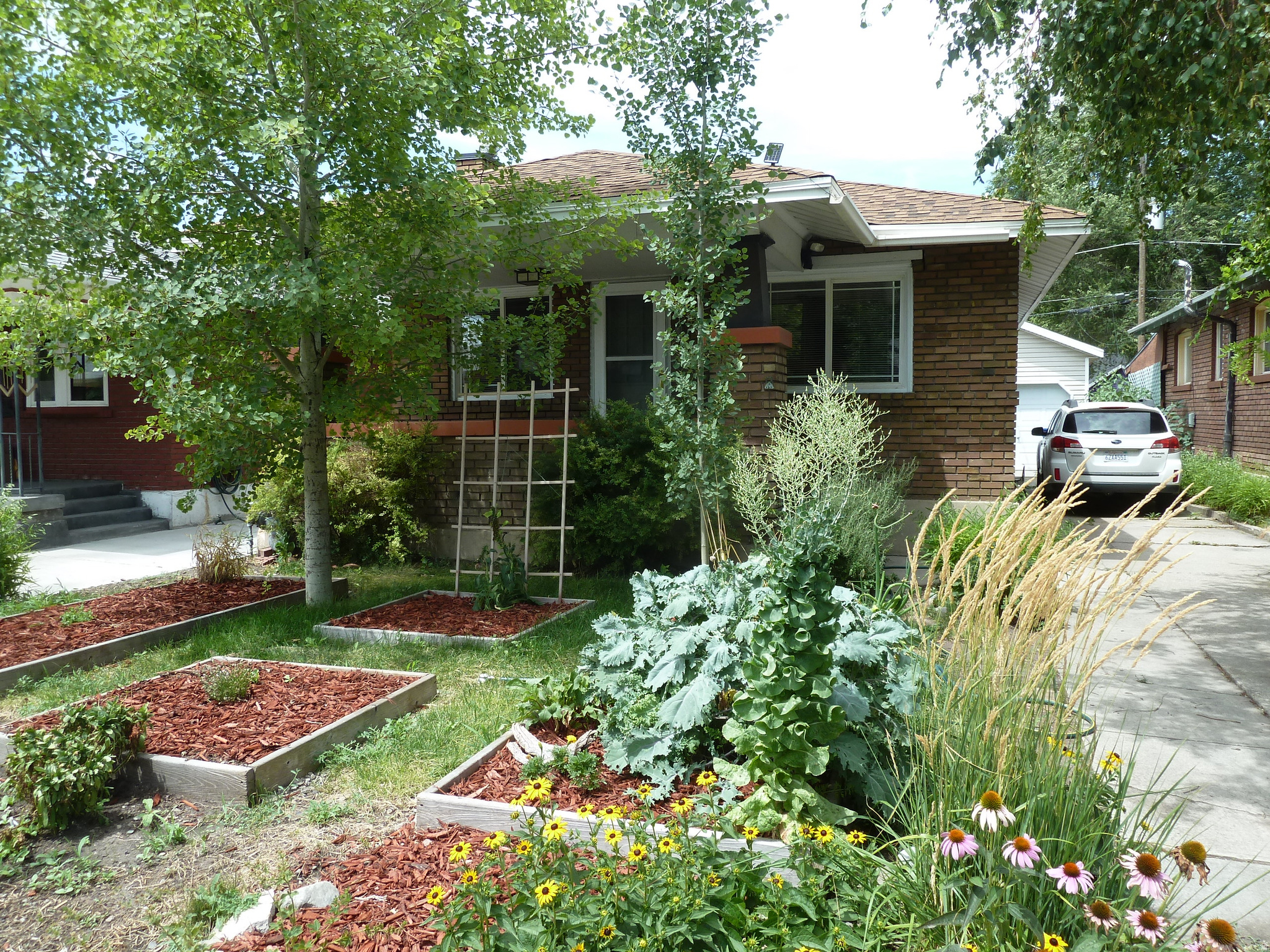 Nestled on a charming, tree-lined street in the heart of Sugar House, this beautiful home offers the perfect blend of character, comfort, and convenience. Just minutes from shopping, popular restaurants, and only a few blocks from Liberty Park, you'll love this highly desirable location. A rare find for the neighborhood, the property features an oversized detached two-car garage with ample space for vehicles, a workshop, and additional parking for a boat or RV. Inside, you'll find two bedrooms, one updated bathroom, and a spacious open-concept kitchen and living area centered around a cozy fireplace. The home comes equipped with central air conditioning and heating, plus a full suite of appliances including a dishwasher, stove, refrigerator, washer, and dryer. Solar panels are installed, offering future energy-saving potential. (Buyer will need to bring the system online with service provider). Step outside to enjoy the inviting front porch, perfect for relaxing in the evenings, or retreat to the private backyard featuring mature fruit trees and a beautiful grape arbor.