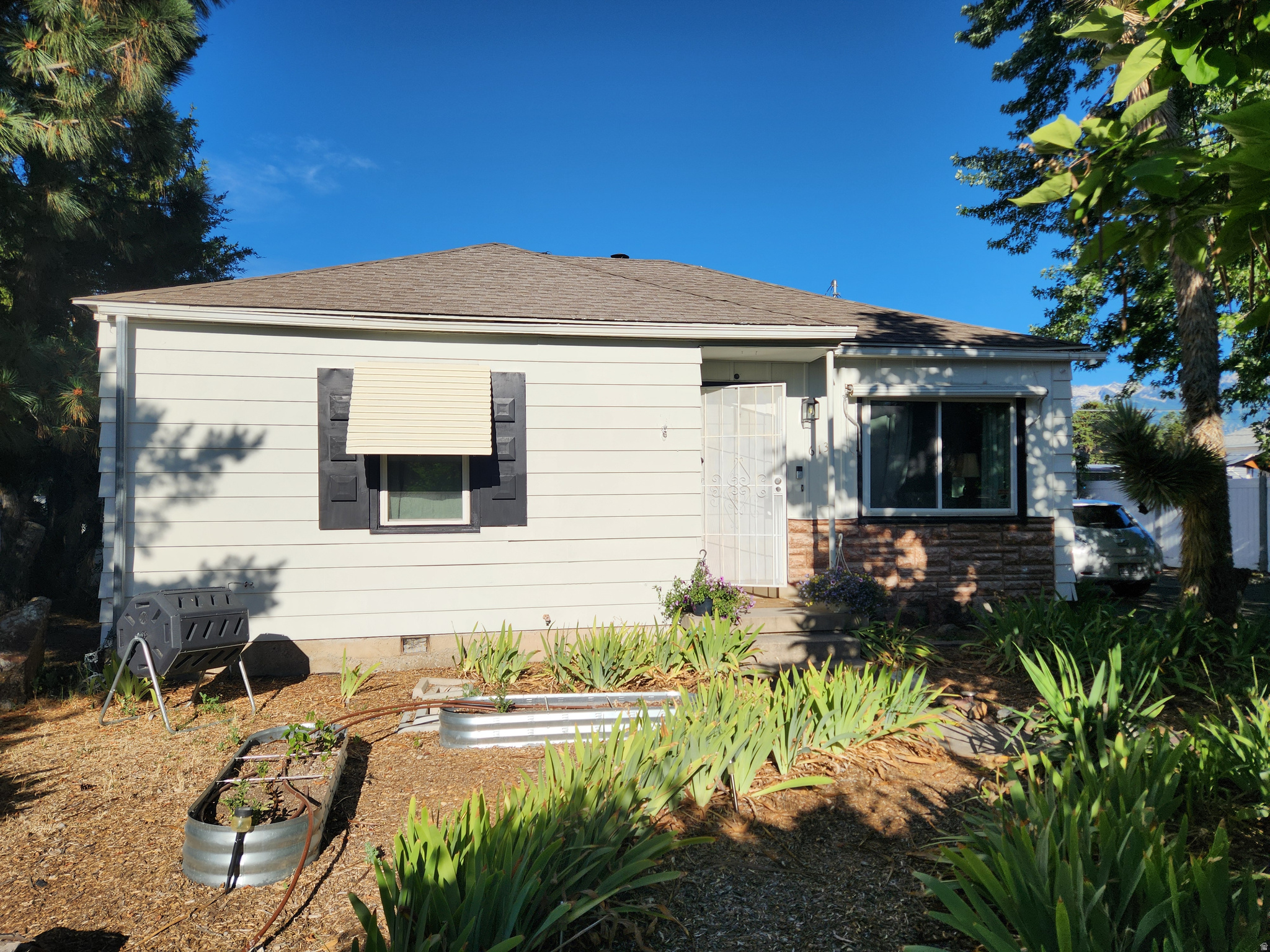 Fabulous Location near Fashion Place Mall, outside the backgate-driveway-is a City Park.  Backdrive could be used to store your trailer.  Backyard has a garden space, firepit, & covered patio area.  Breezeway between the home & yard is secured with metal door.  OVERsized 2+ car garage detached. Inside the home, all electrical has been upgraded, *all new energy efficiency windows, *foam install in walls, makes it very quiet, *18 Solar Panels that are Paid Off.  **Nissan ELECTRIC VEHICLE CAR CHARGER included.* Big Soaker Tub plus Tub/shower that has door, walk in access for easier access.  *Gas Range in Kitchen.* Mini kitchen set up in back room with refrigerator, hot plate & microwave. *Hardwood floors under laminate. * Owner loved this home and it shows.** 24 hours plus needed for showings/tenant occupied. See comments for showing times.