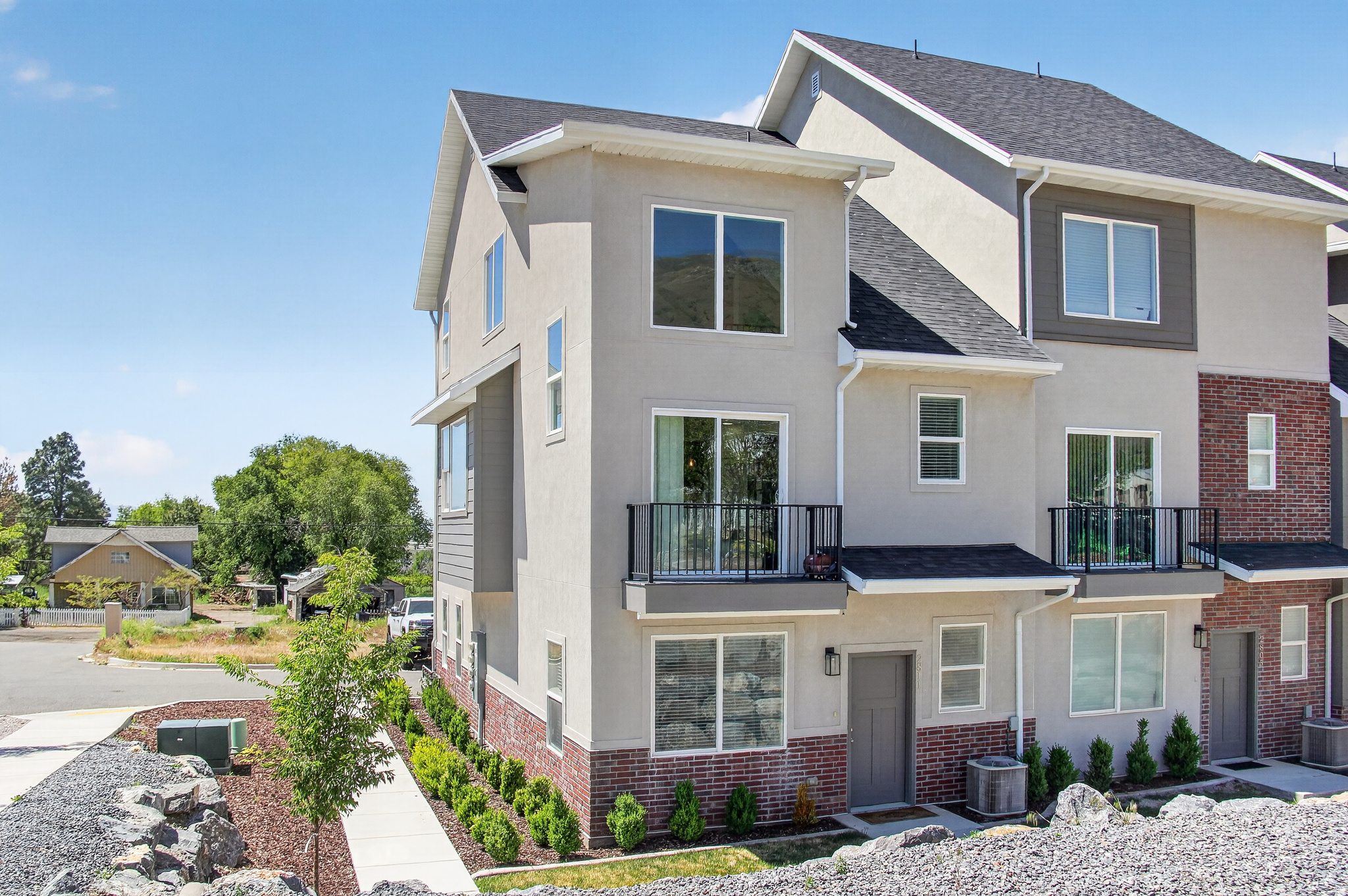 Luxury, Views & Location!  This gorgeous 3-bedroom, 3-bathroom townhouse delivers the perfect mix of style and convenience. Enjoy breathtaking mountain views from your private second-floor balcony, or cook up a masterpiece in the open-concept kitchen featuring premium quartz countertops and high-end appliances. Need a home office, gym, or playroom? The main-floor bonus room offers ultimate flexibility to fit your lifestyle. Complete with a 2-car garage and located in a scenic neighborhood close to schools, local produce stands, and outdoor trails. This rare find won't last long-schedule your tour today! VA assumable loan or Seller Financing Available.