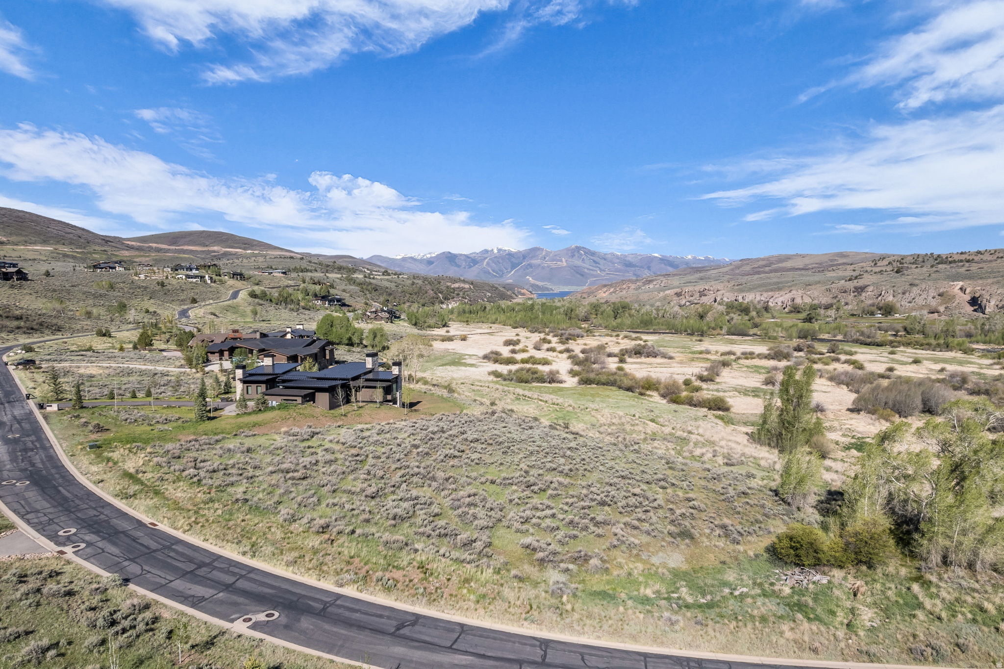 One of Victory Ranch's Premier Homesites, Lot 22 offers unobstructed views of Deer Valley with protected open space & the river trail below, creating an endless backdrop. This flat 1.19 acre homesite offers a generous building envelope, making the building process straightforward and efficient. Just a short walk to The Post, where owners can unwind & relax by the pool, grab lunch and take in the surrounding rock cliffs and scenery. Victory Ranch is a premier four-season ranch club community spanning 6,250 acres, including over 3,500 acres of pristine backcountry. Amenities include Utah's #1 ranked golf course, four miles of the Upper Provo River for world-class fly fishing, multiple clubhouses and restaurants, biking and hiking trails, a 5-stand shooting facility, ATV and snowmobiling adventures, a Park City ski lodge on Main Street, ice rink, backcountry yurts, fishing ponds, pools with a waterslide, tennis and pickleball courts, and The Barn featuring an art studio, game room, indoor basketball court, fitness center, and luxurious spa. Plat map is attached to the listing.