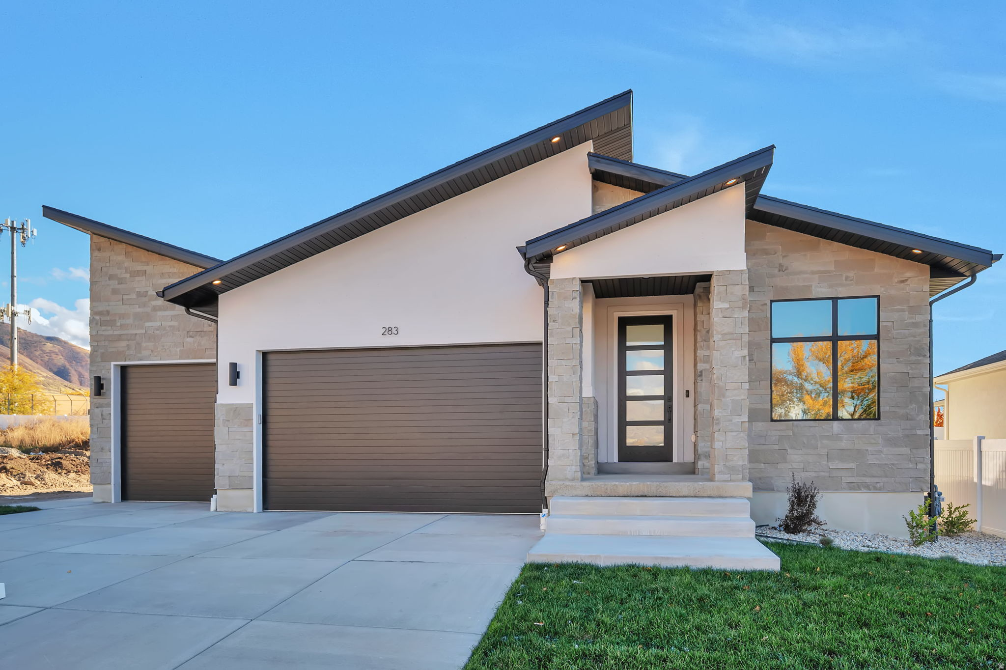 LOT#147 in Summerhill Lane by Symphony Homes, featuring the 'Metro' plan with a modern roofline and appeal. This home is thoughtfully designed with stunning custom millwork throughout, including a grid wall in the flex room, built-in mudroom bench with hooks, and a dramatic shiplap recessed ceiling in the primary suite. The spacious great room centers around a cozy fireplace and flows seamlessly into the kitchen with Z-line appliances, and generous counter space. Large walk-in pantry, dedicated laundry room with cabinet/countertop, and spacious 1/2 bathroom with vanity. Enjoy outdoor living on the covered patio. The finished basement offers a large open family room, 9' foundation walls, cold cellar, and an active radon system for peace of mind. Brand new and already fully landscaped! Must see!
