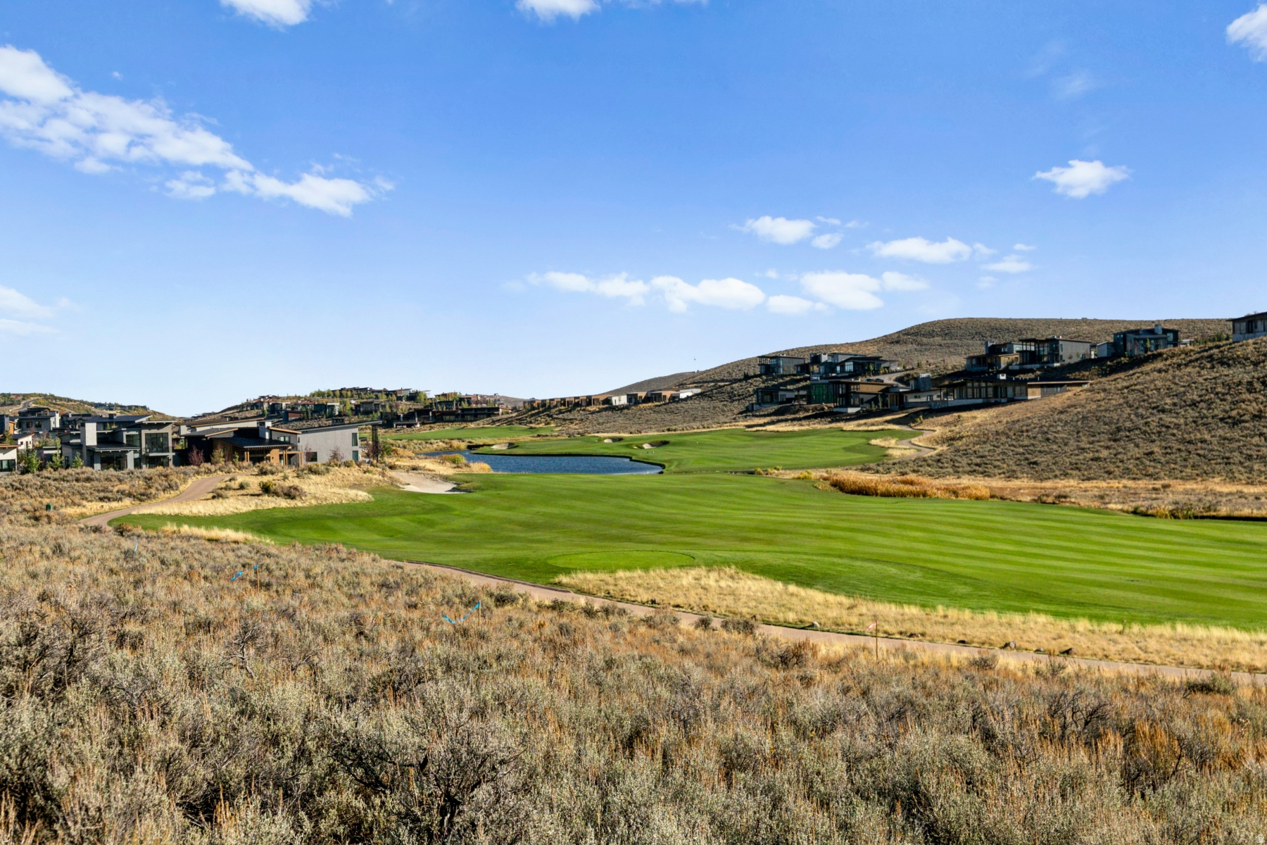 Scenic Valley lives up to its name, offering a peaceful retreat defined by panoramic views and natural beauty. Overlooking the dramatic Uinta Mountain Range, this neighborhood features thoughtfully positioned homesites ideal for building your custom mountain residence. Select homesites enjoy golf frontage along the Jack Nicklaus course, creating a setting that feels both private and connected to the surrounding landscape. Tucked near the Painted Valley gate for easy access, Scenic Valley also places residents within walking distance of the Double Deer Clubhouse--perfect for an evening dinner, a day at the spa, or a quick stop at the pro shop. Just minutes from the Promontory Beach Club and surrounded by scenic trail systems, the neighborhood offers a balance of relaxation and recreation. With Deer Valley's East Village lifts less than a 15-minute drive away, Scenic Valley is an ideal home base for year-round mountain living.