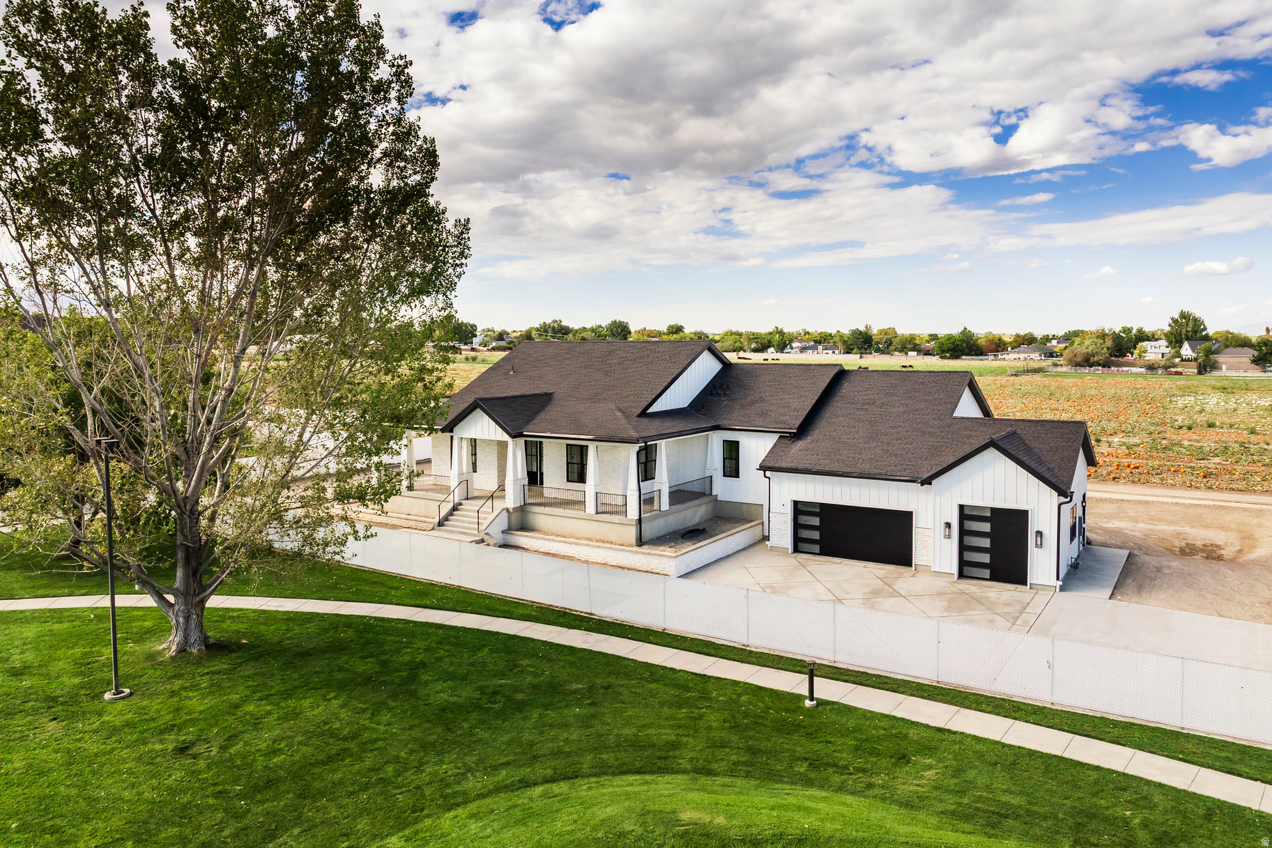 Back on the Market, and better than ever. Special jumbo loan financing is available through our preferred lender, making this one of the most accessible opportunities in the luxury new construction market right now.  Tucked at the end of a private lane on a rare 0.45-acre lot in South Jordan, this stunning new construction rambler delivers something 84095 rarely offers anymore: space, silence, and views that stop you mid-sentence. Unobstructed mountain panoramas frame nearly every window, and the breathing room out front feels worlds away from the typical neighborhood grid. Inside, nearly 3,000 sq ft of main-level living unfolds beneath soaring ceilings, open, airy, and designed with intention. The gourmet kitchen is built around a full Thermador appliance package and anchored by a butler's pantry that actually functions the way entertaining demands. Gatherings here feel effortless. The primary suite earns the word retreat, a freestanding soaking tub, an oversized walk-in shower, and the rare quiet that only comes from a home genuinely set apart from the street. Downstairs, the walkout basement opens directly to your lot and includes two finished bedrooms, a full bath, and a generous family room. Beyond that, you have unfinished space with a private entrance and plumbing already roughed in for a second kitchen. The ADU potential is exceptional, whether you're envisioning multi-generational living, a mother-in-law apartment, or long-term rental income. Flexible seller incentives are available to help make that vision a reality.