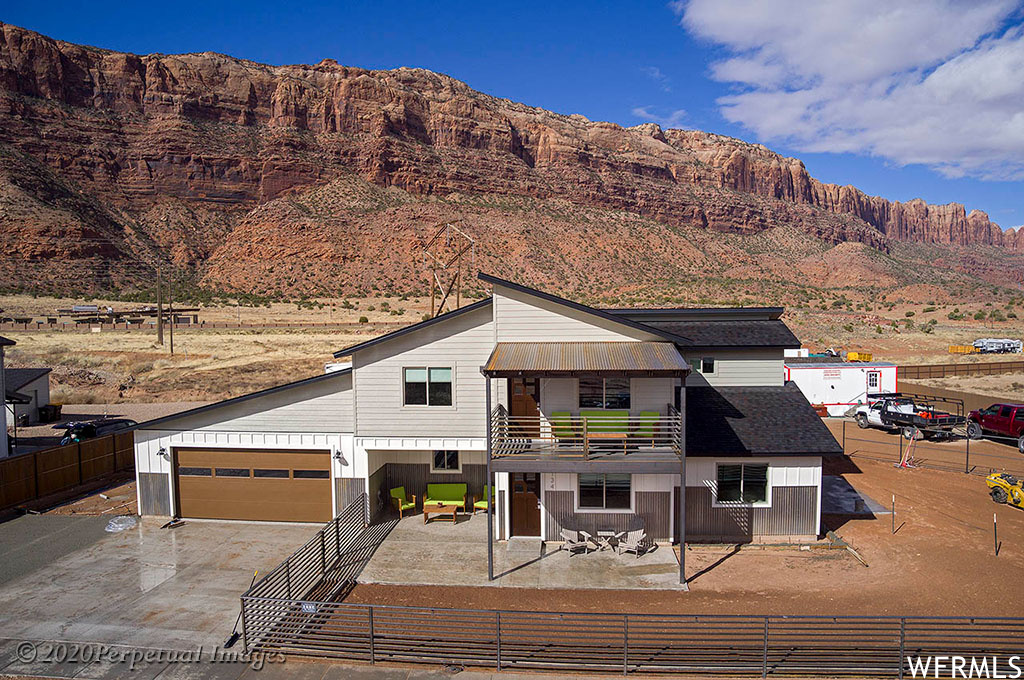 Custom Single Family Residence to built in the Business Flex Zone in San Juan County, Nightly rentals permitted. Beautiful view of the La Sal Mountains. Kitchen with butler pantry, quartz counter tops. Upstairs has a bonus room with a covered balcony, wet bar, and office space. Three patios, one in front, one in back and one off the master bedroom. Choose where you want to relax and enjoy the stars. Garage has plenty of room to fit a large pickup. Garage doors are 18ft wide and 8ft high. Exterior is Smart Side LP siding, more durable than sidings, bottom is metal. Very attractive look. House has central vacuum and is pre wired for wireless broadband. Well insulated.
