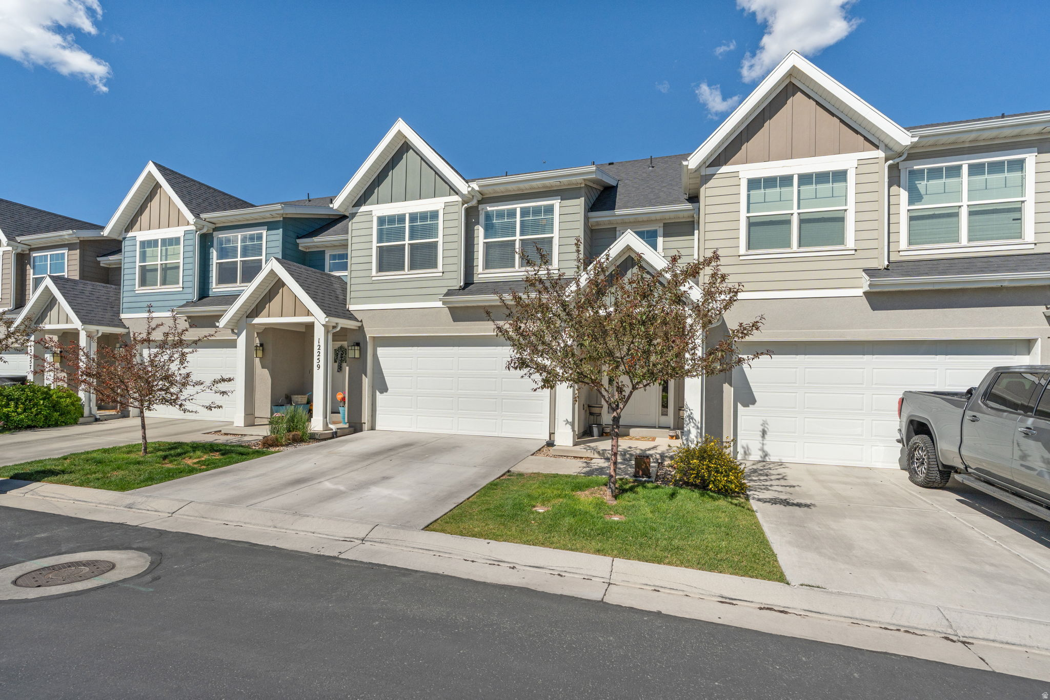 Welcome to this beautifully maintained townhome in one of Herriman's fastest-growing communities, where stunning Wasatch and Oquirrh Mountain views set the backdrop for everyday living. The open-concept main floor impresses with soaring two-story ceilings, wood-look LVP flooring, and a bright, modern kitchen featuring white shaker cabinets, granite countertops, stainless appliances, and a peninsula island with bar seating - perfect for gathering.  Upstairs, the generous primary suite includes a walk-in closet and a beautifully finished en suite with dual sinks and granite countertops. Two additional bedrooms and a full hall bath complete the upper level, along with the convenience of upstairs laundry. The full basement - already framed and insulated - is ready for your personal touch and adds tremendous potential value.  Located along the Mountain View Corridor with new shops and dining just around the corner and top-rated Jordan School District schools nearby, this home truly has it all. Join us for a Grand Open House this Saturday, 10:30 AM to 1:00 PM - we'd love to see you there!