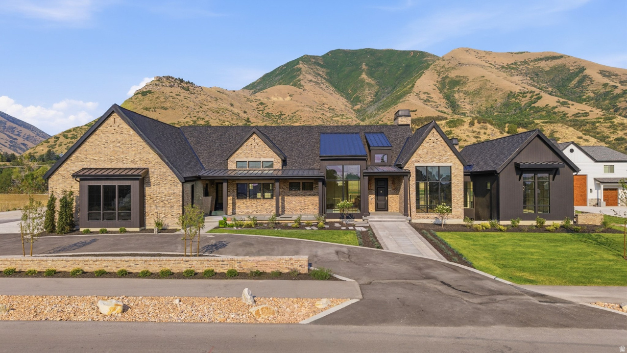 Welcome home to this stunning brand new luxury custom rambler nestled on just over an acre in Mapleton's highly sought after Wren Meadows subdivision. The home offers 5 bedrooms, 5 full baths, and 1 half bath, surrounded by gorgeous mountain views. The beautiful gourmet kitchen features quartz countertops, custom cabinetry, high end lighting, and designer finishes that carry throughout the entire home. The main level includes a spacious great room with large sliding glass doors that open to the covered deck, a den and office, a main level primary suite with a large walk in closet, and a dedicated gym complete with a sauna and cold plunge. Radiant heated floors run throughout the home, keeping it warm and comfortable through every Utah season. The fully finished basement is designed for fun and relaxation, featuring 4 bedrooms, a kitchenette, a living room, and a state of the art theater room perfect for movie nights and game days. Set on just over an acre, the backyard offers unobstructed mountain views and outstanding privacy. Two covered patios, a fully landscaped front yard, and a five car garage that is as impressive as the rest of the home complete this incredible property. Why spend years designing and building when you can move right into this extraordinary home and start enjoying it today. Schedule your private showing and come experience one of the finest homes on the market in Utah County.