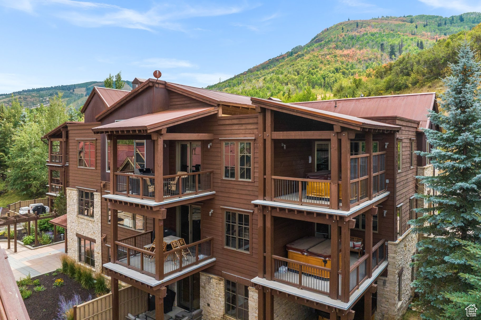 Just steps from the Silver Star Chairlift, this top-floor end unit offers direct ski access and unmatched convenience year-round.  Inside, you'll find vaulted ceilings, hardwood floors throughout, ensuite bedrooms, a private hot tub, stainless Viking appliances, generous storage, multiple decks, a spacious laundry room, and two fireplaces. The open-concept great room and kitchen are true standouts-with dramatic vaulted ceilings, a striking fireplace, oversized windows, and stunning mountain views. Tiled bathrooms and granite countertops add to the refined feel, while Silver Star's top-tier amenities-year-round heated pool, hot tub, fitness center, fire pits, ski locker, and winter shuttle-complete the experience. In the summer, step out your door to world-class hiking and mountain biking on the Armstrong and Spiro trails.  A rare opportunity to own a turnkey, top-floor end unit in one of Park City's most sought-after ski-in/ski-out communities.