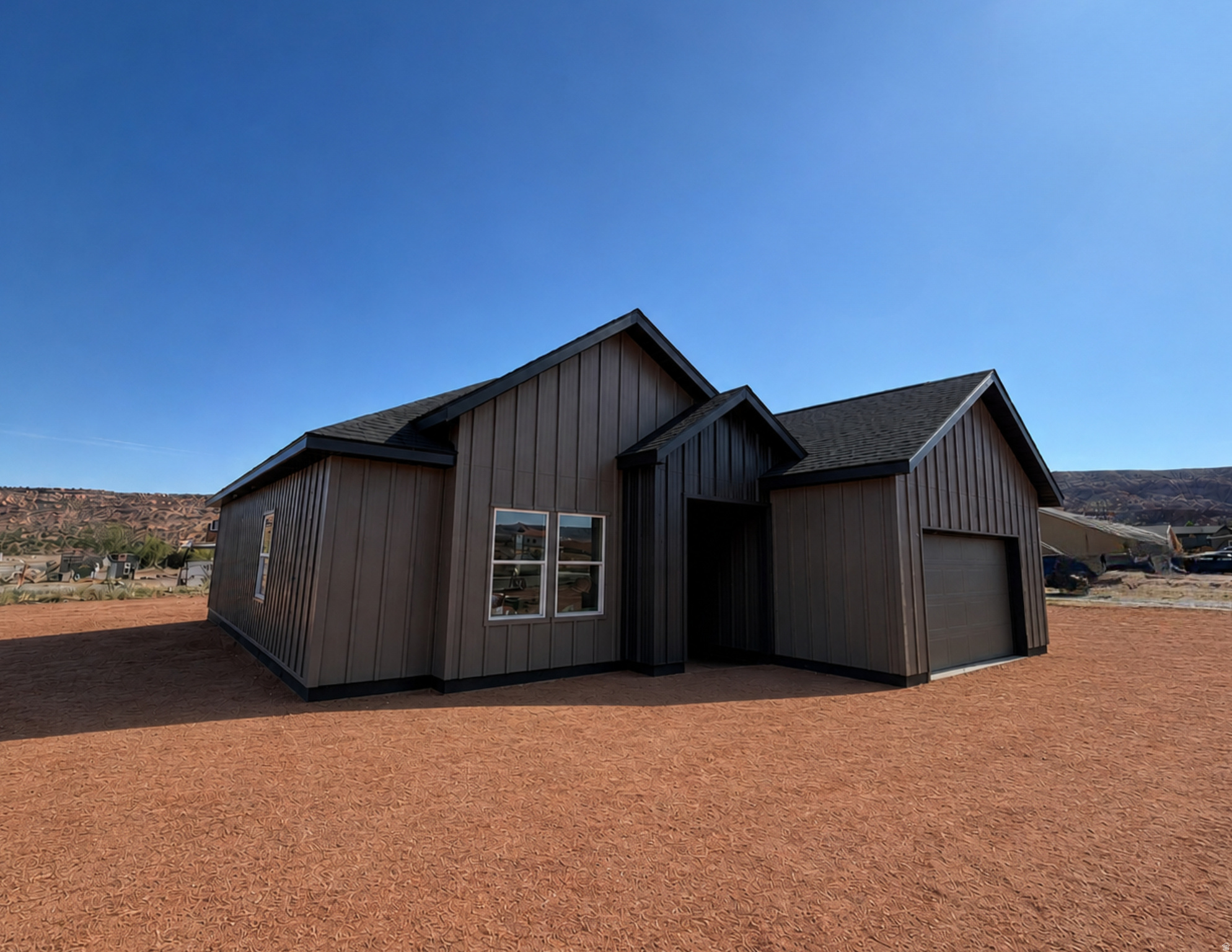 NEW CONSTRUCTION home in Spanish Valley, south of downtown Moab. This beautiful three-bedroom, two-bathroom home offers a comfortable and modern living space surrounded by stunning red rock and mountain views. The home features LVP flooring throughout the main living areas, with soft carpet in each bedroom for added comfort. Both bathrooms include tiled showers, and every bedroom offers a walk-in closet. Large windows throughout the home provide plenty of natural light and showcase the breathtaking scenery in every direction.  Photo is a rendering of what the home will look similar to, finishes will not be exact.