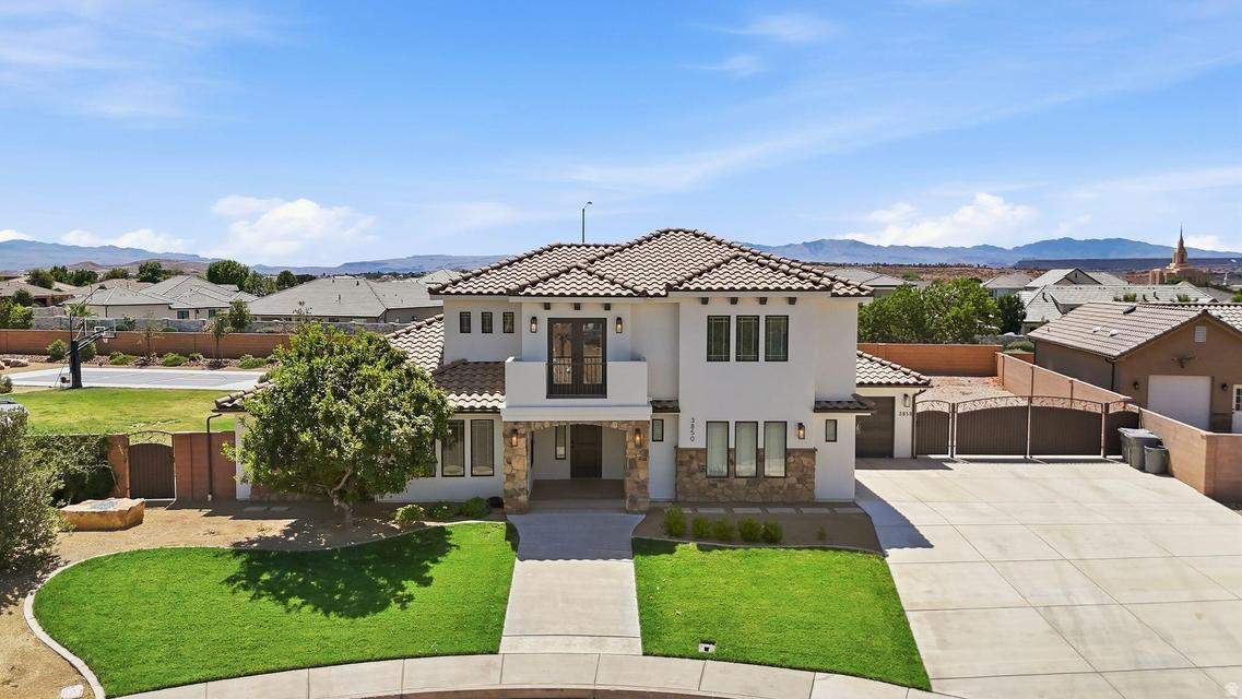 Situated on over half an acre in the desirable Washington Fields area, this stunning custom home has been fully remodeled and truly feels like new! Thoughtful updates throughout include freshly painted window frames, trim, and stucco, along with new high-end A/C units, new lighting, paint, hardware, countertops, and a striking new kitchen island, creating a fresh, upscale feel from the moment you walk in. The spacious open floor plan is filled with natural light and offers exceptional functionality with a mudroom, laundry room with extra storage, spacious bedrooms, and a luxurious primary suite featuring dual vanities, a soaker tub, walk-in shower, large walk-in closet, and private backyard access. Upstairs, a second family room opens to a balcony where you can take in breathtaking views of Pine Valley and the surrounding red rock mesas. Step outside to the huge resort-style backyard featuring gated RV parking, an expansive covered patio with a fan and lighting, built-in surround sound speakers, a large pool with waterfalls and lighting, a pickleball/basketball court, garden area, custom gates, and plenty of room to add a workshop or RV garage. An extra-large 3.5-car garage provides ample space for vehicles, toys, and storage. Located in a desirable subdivision close to top-rated schools, shopping, dining, and recreation, this exceptional property offers the perfect blend of luxury, space, and Southern Utah living. Buyer to verify all information, deemed reliable; however, buyer to verify all information including utilities, rental restrictions, and HOA information if applicable.