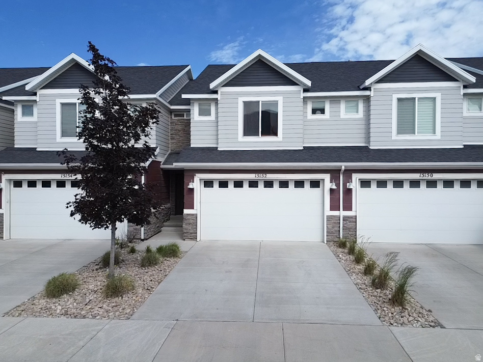 Discover this beautifully maintained townhouse in a peaceful Utah community! Nestled on a quiet street with only residential traffic, this home offers the perfect blend of tranquility and unbeatable convenience-just 3 minutes from the I-15 onramp and minutes from the mountain corridor highway. You're also super close to the bustling tech hub in Lehi, making commuting and lifestyle effortless. Inside, enjoy an exceptionally spacious master bedroom featuring a generous his-and-hers closet, plus a fully finished walkout basement that provides a fourth bedroom, a third full bathroom, and comfortable living space-ideal for guests or a home office working space. The two-car garage boasts epoxy flooring and convenient overhead storage (4 parking spaces including driveway), while the oversized washer and dryer add everyday practicality. This move-in ready townhouse delivers comfort, space, and location in one outstanding package.