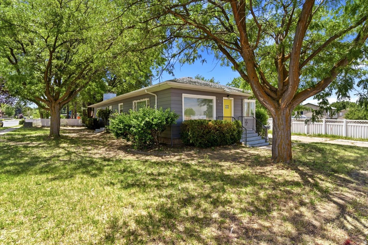Step into a home that feels brand new! This fully renovated 5-bedroom, 2-bathroom home features a stunning new kitchen, remodeled primary ensuite, new flooring, fresh paint inside and out, updated lighting, and a cozy electric fireplace. Situated on a corner lot with a large yard, storage shed, and 1 car garage, this move-in-ready property offers the perfect combination of space, style, and comfort.  Ideally situated with easy access to major transportation routes and upcoming infrastructure enhancements, making daily commuting and travel throughout Davis county more convenient than ever.