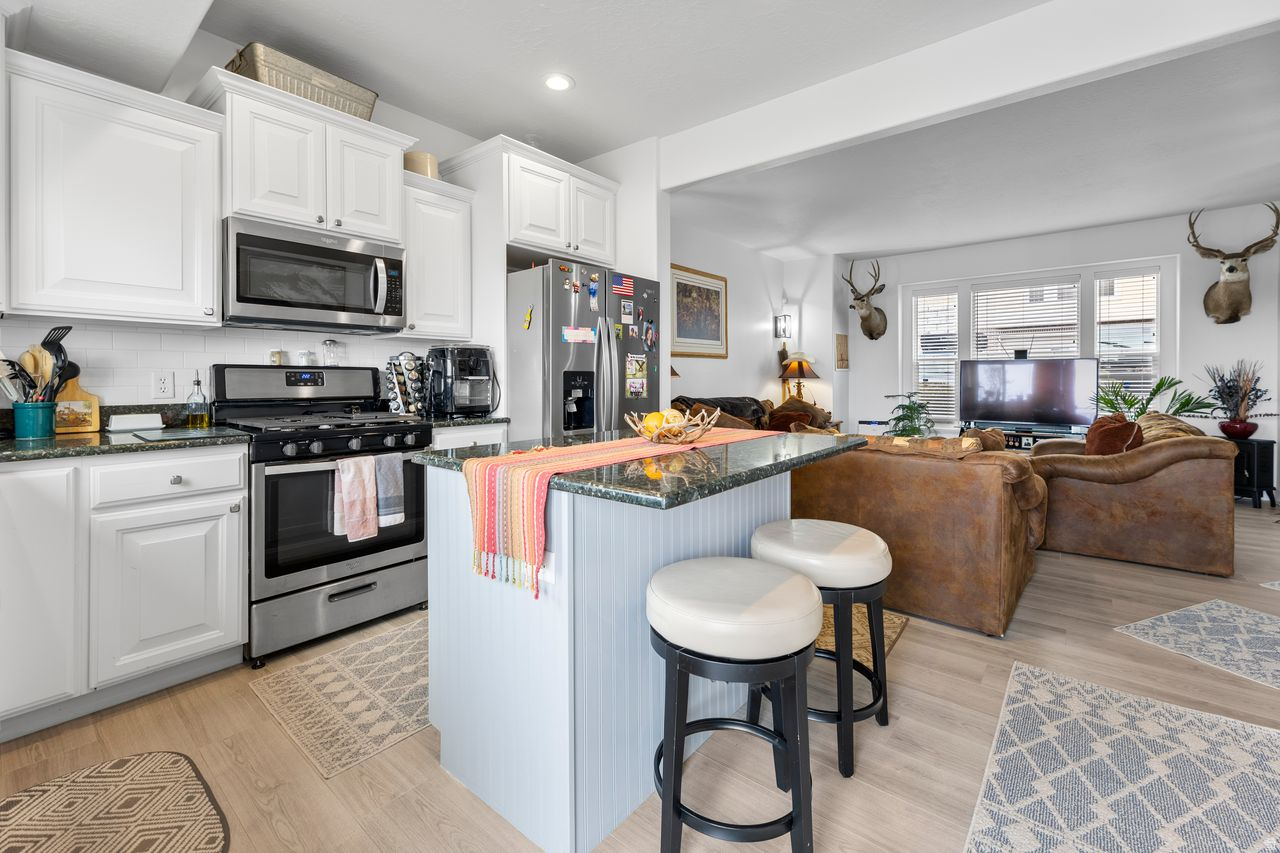 This beautifully updated 3-bedroom townhome offers the perfect blend of comfort, style and convenience. The inviting main level features an open-concept design filled with natural light, complemented by solid-surface countertops, stainless steel appliances and seamless living and dining spaces ideal for everyday living or entertaining. Upstairs, the  primary suite provides a private retreat with an ensuite bath and walk-in closet. Located just minutes from the renowned Corner Canyon trail system, Draper City Park, shopping, dining and everyday amenities, this home places outdoor adventure and convenience right at your doorstep. With quick access to I-15, commuting to Silicon Slopes, Lehi or downtown Salt Lake City is effortless. Set within a well-maintained community, this property offers an exceptional opportunity to enjoy the best of Draper's active lifestyle.