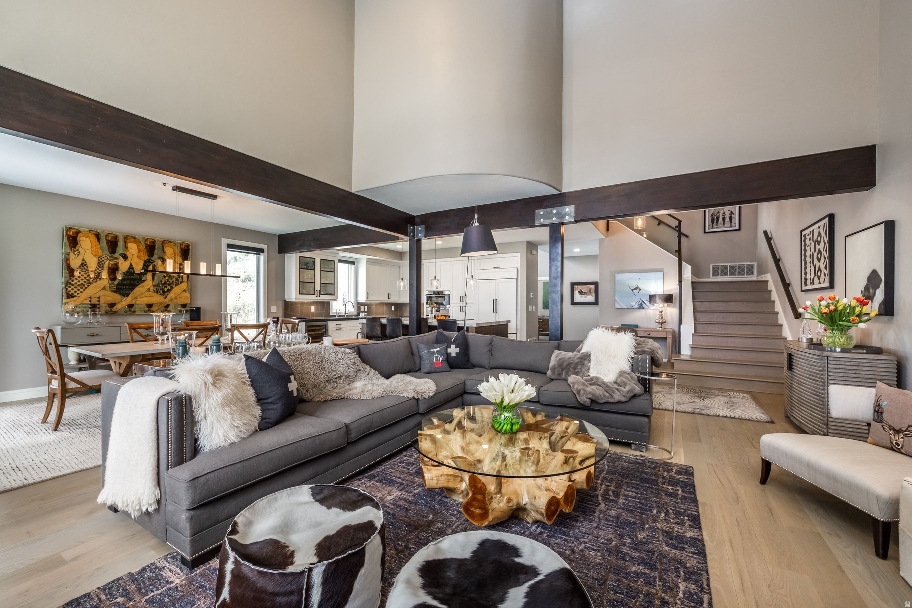 Enjoy beautiful ski run views of Deer Valley and Park City Mountain from this thoughtfully reimagined corner residence in the coveted Cove at Eagle Mountain in Park Meadows. Thoughtfully renovated and meticulously maintained, this 3 bedroom, 3.5 bath home blends elevated mountain design with modern comfort. The open concept main level is filled with natural light, highlighted by vaulted ceilings, expansive windows, and curated designer lighting. The chef's kitchen is both functional and striking, featuring Sub-Zero and Wolf appliances, and large island with custom cabinetry and refined finishes throughout. The adjacent dining and living spaces create an inviting setting for both everyday living and entertaining, anchored by a dramatic floor-to-ceiling stone fireplace. Each bedroom is en suite, offering privacy and comfort for family and guests alike. The primary suite is a true retreat, complete custom detailing, a spa-inspired bath with soaking tub and walk-in shower, and access to a private balcony with stunning ski run views. Extensive upgrades include whole-home systems, Sonos audio, new mechanicals, a tankless water heater, and a heated garage with epoxy floors and built-in storage. Outdoor living is enhanced with patio, gas connection, and infrastructure for a hot tub. Located just minutes from Park City's world-class ski resorts, hiking and biking trails, and Historic Main Street, The Cove offers exceptional amenities including a pool, hot tub, clubhouse, and tennis courts, creating a seamless blend of convenience, recreation, and refined mountain living.
